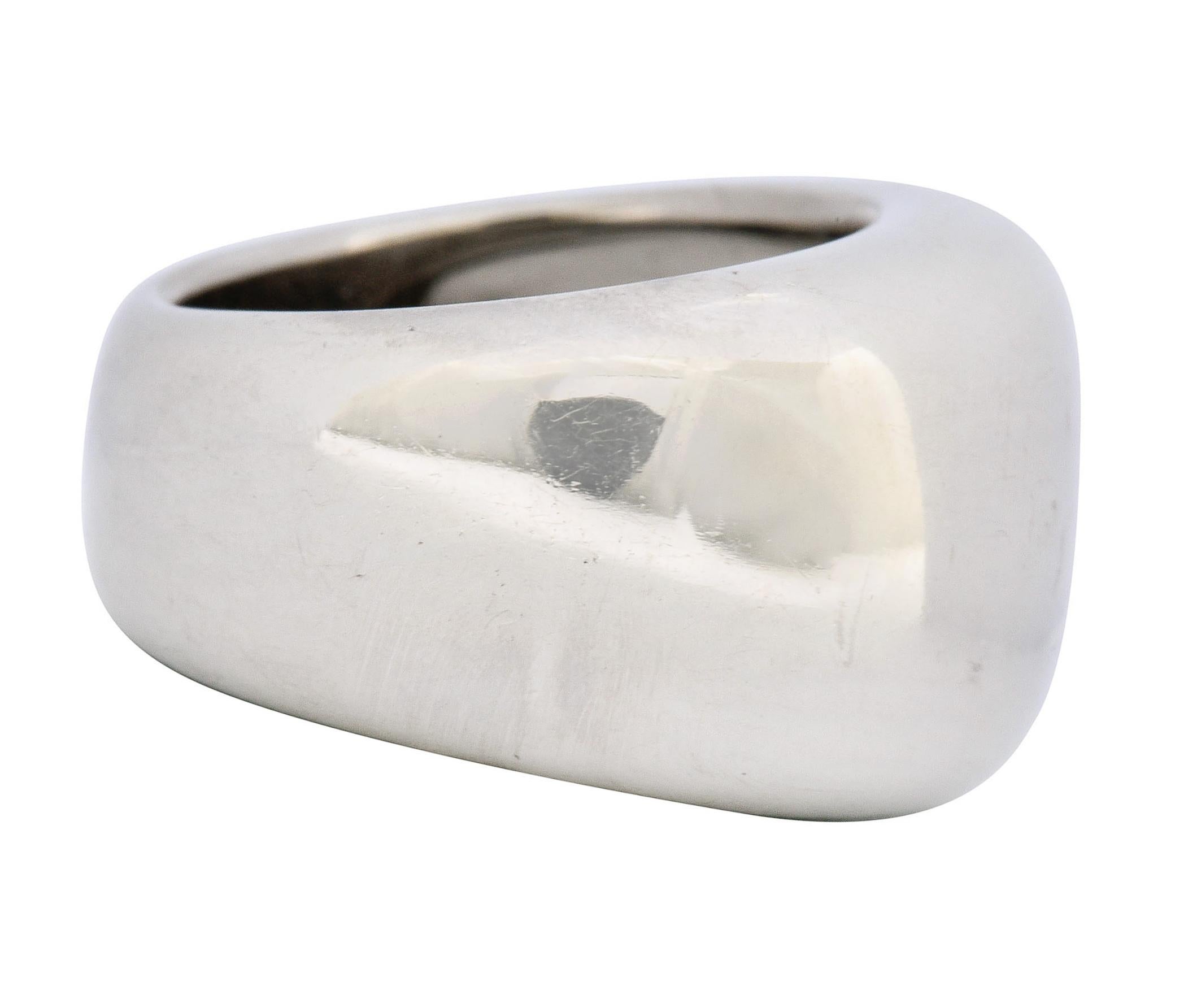 Designed as a puffed and polished band ring

Tapering in width from top to bottom

With maker's mark at base of shank

Numbered and fully signed Cartier

Stamped 750 for 18 karat gold

From the vintage Nouvelle collection, circa 1997