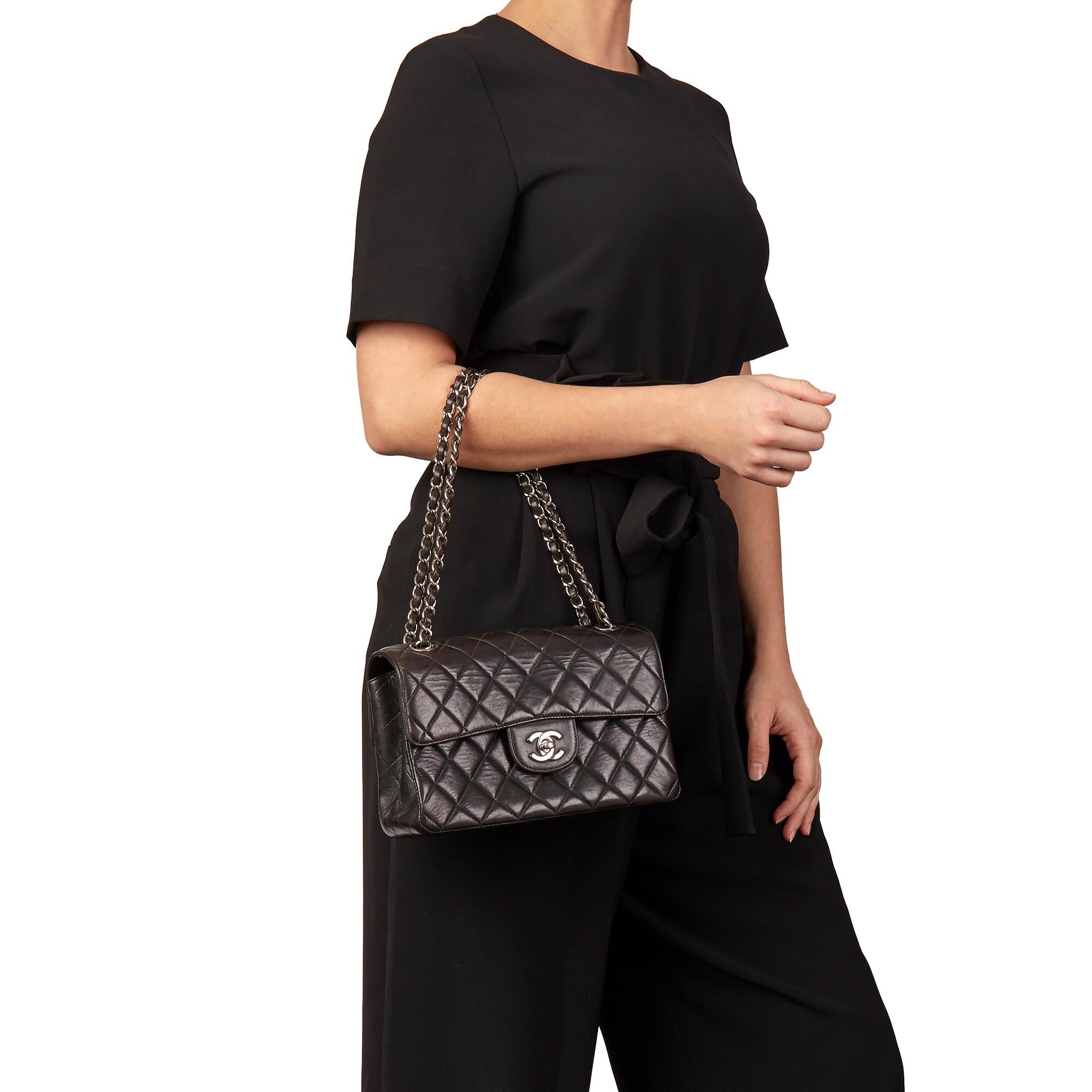 CHANEL
Black Lambskin Vintage Double Sided Classic Flap Bag 

Xupes Reference: HB3161
Serial Number: 4630782
Age (Circa): 1997
Authenticity Details: Serial Sticker (Made in France)
Gender: Ladies
Type: Shoulder

Colour: Black
Hardware: Silver