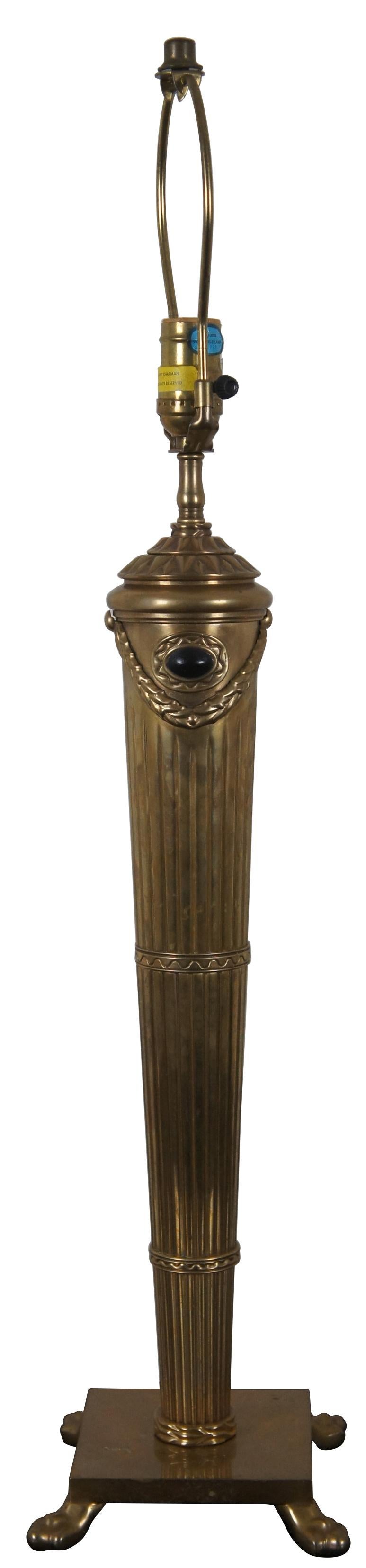 Vintage 1997 Chapman Brass table lamp in the shape of a neoclassical torch with black accents on a square base with paw feet. A stunning lamp drawing inspiration from Empire and Regency styling.
  