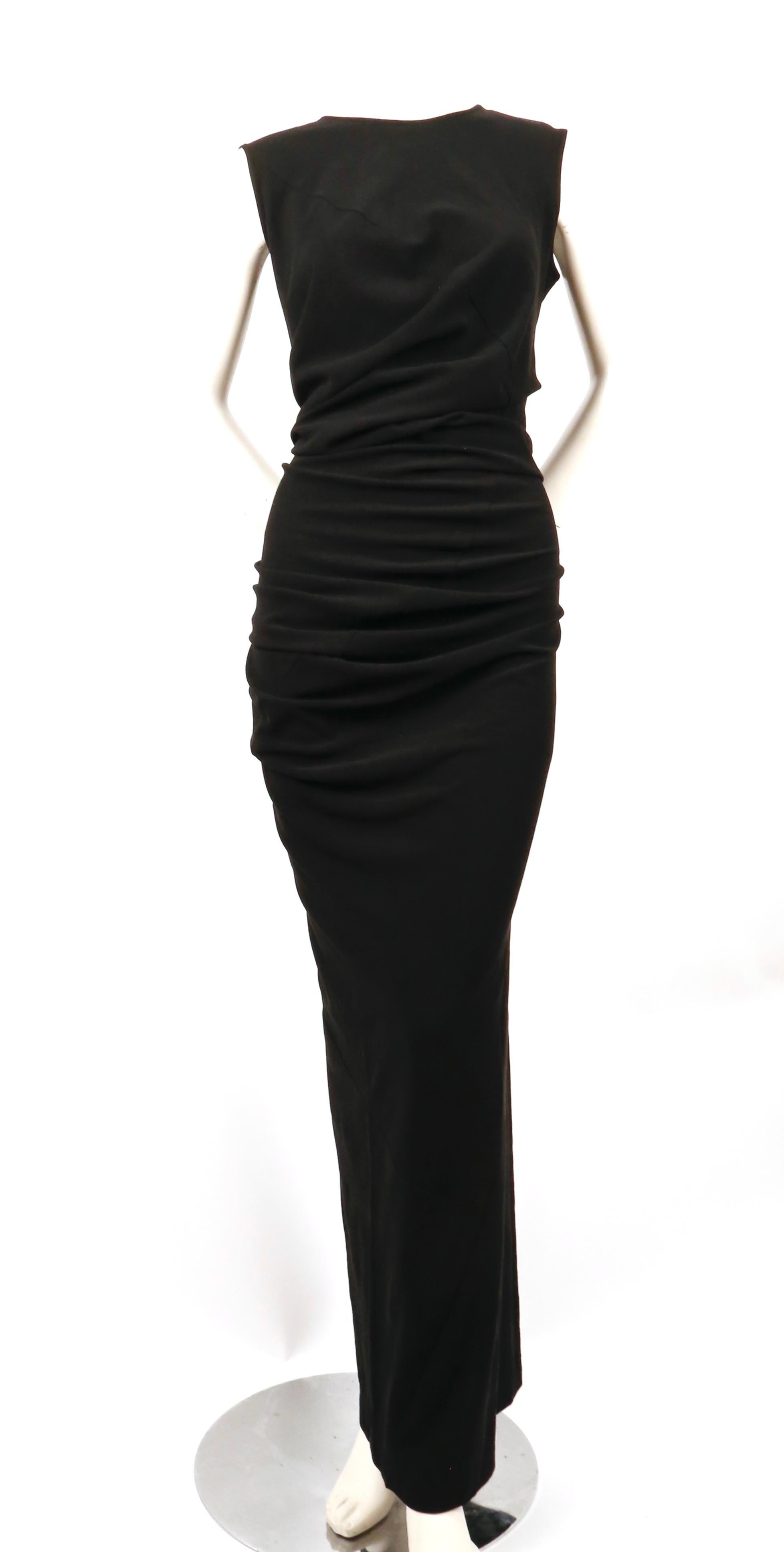Very rare, 'bump' dress designed by Rei Kawakubo from the highly sought after 'body meets dress, dress meets body', lumps and bumps collection, exactly as seen on the Spring 1997 runway. Dress spirals around the body leaving a 'bump' on the lower
