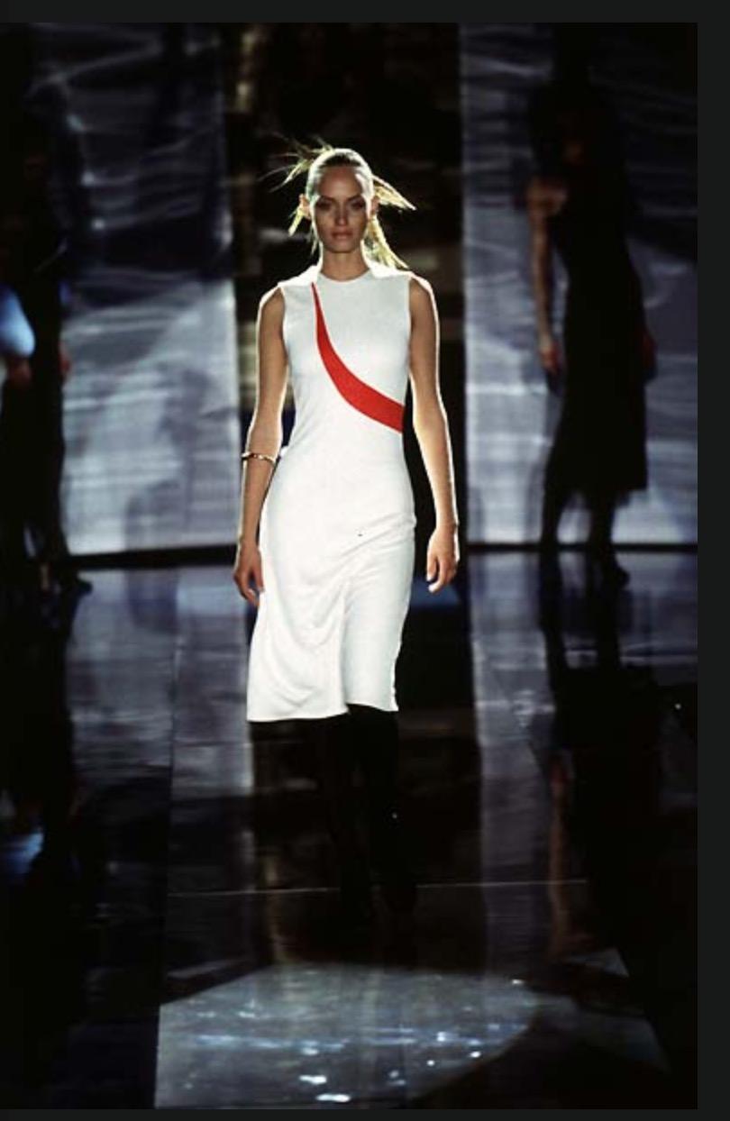 Presenting a beautiful Gianni Versace Couture knit dress designed by Gianni Versace. From 1997, this knit dress features a yellow detail at the front that connects to an identically shaped blue detail at the back. Chic and simple, this dress'