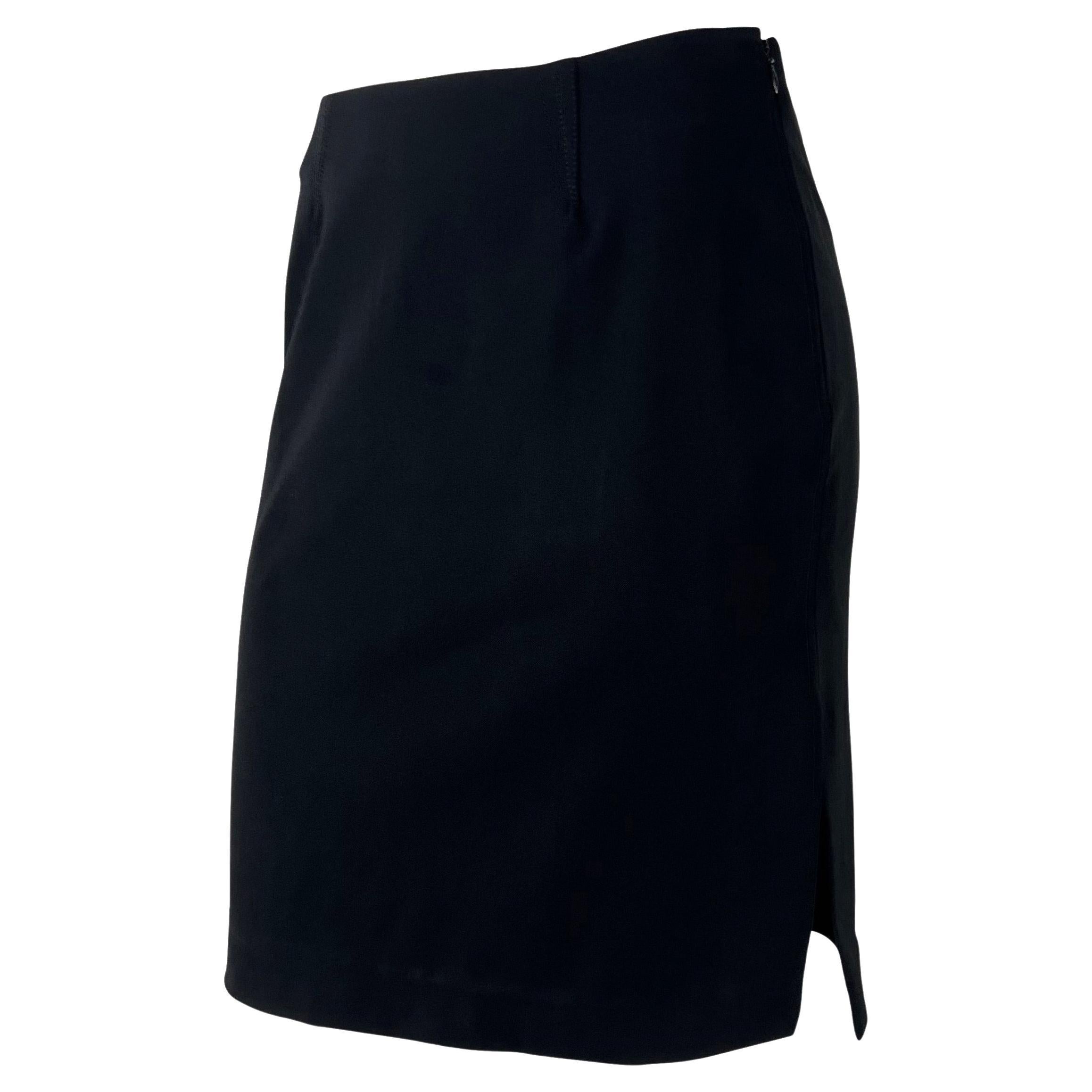 TheRealList presents: a black Gucci skirt, designed by Tom Ford. From 1997, this classic black skirt features short pleats at the top of the skirt and is made complete with a slit at the side. Why have any other black skirt when it can be Gucci by