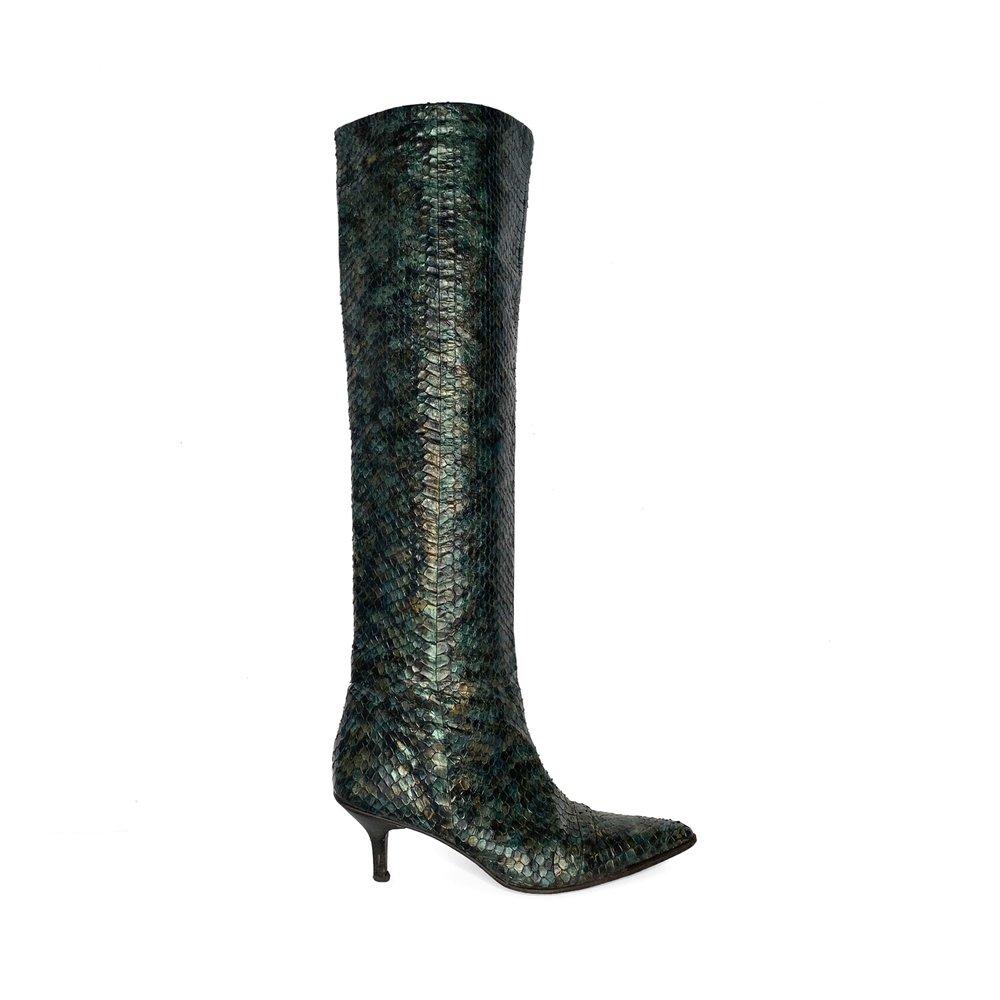 Deep green Gucci by Tom Ford python snakeskin knee high boots from the Spring Summer 1997 runway collection, as seen in in polaroid backstage photos of Kate Moss during the fitting, and campaign images shot by Mario Testino. Pointed toe, pull on