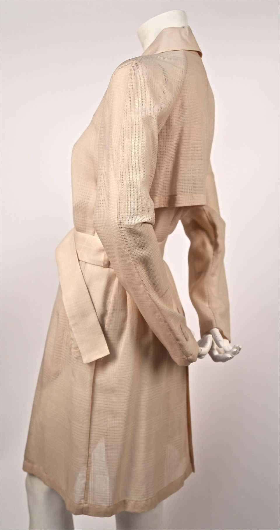Delicate, dusty-pink , semi-sheer, minimalist trench coat with windowpane woven fabric designed by Helmut Lang dating to spring of 1997. Italian size 40. Approximate measurements: shoulder 16