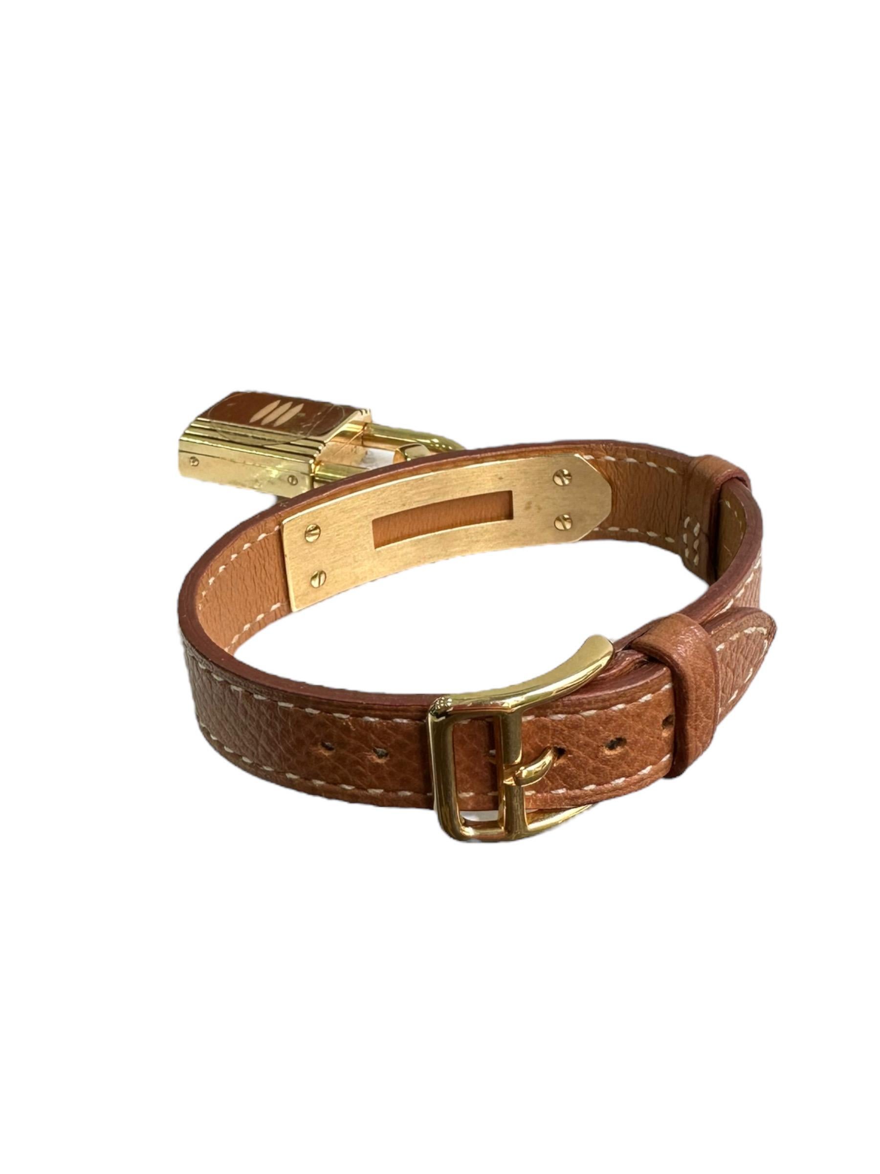 Watch signed Hermès, Kelly model, strap made of Barenia-colored Epsom calfskin with gold-tone hardware. Equipped with a pin buckle closure. Fitted with a rectangular pendant padlock dial without numbers. The strap measures 20cm in length and 1cm in