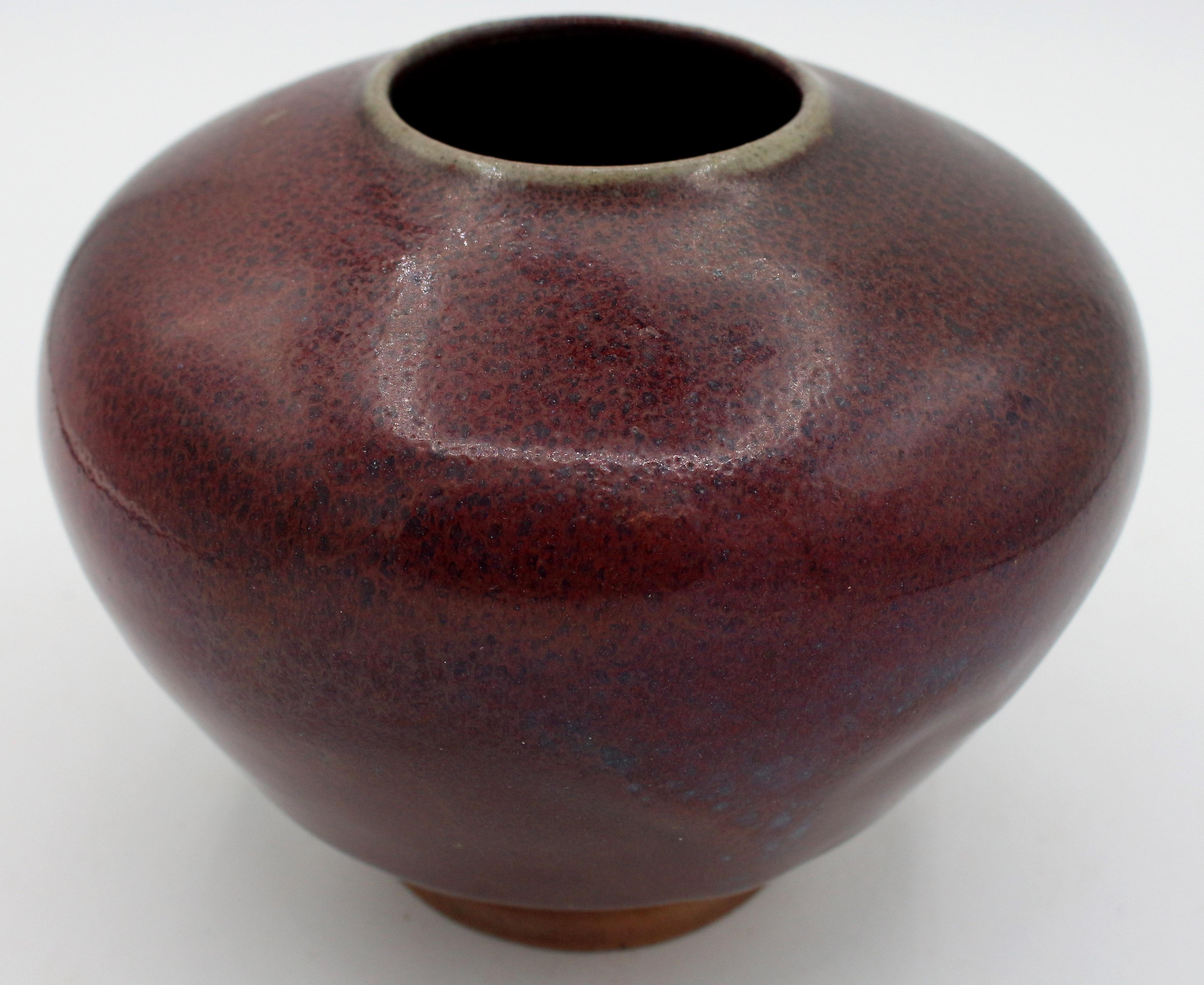 1997 Jugtown Ware pottery vase by Vernon Owens. Elegant Asiatic form with aubergene glaze. Inscribed & stamped marks.
5.5