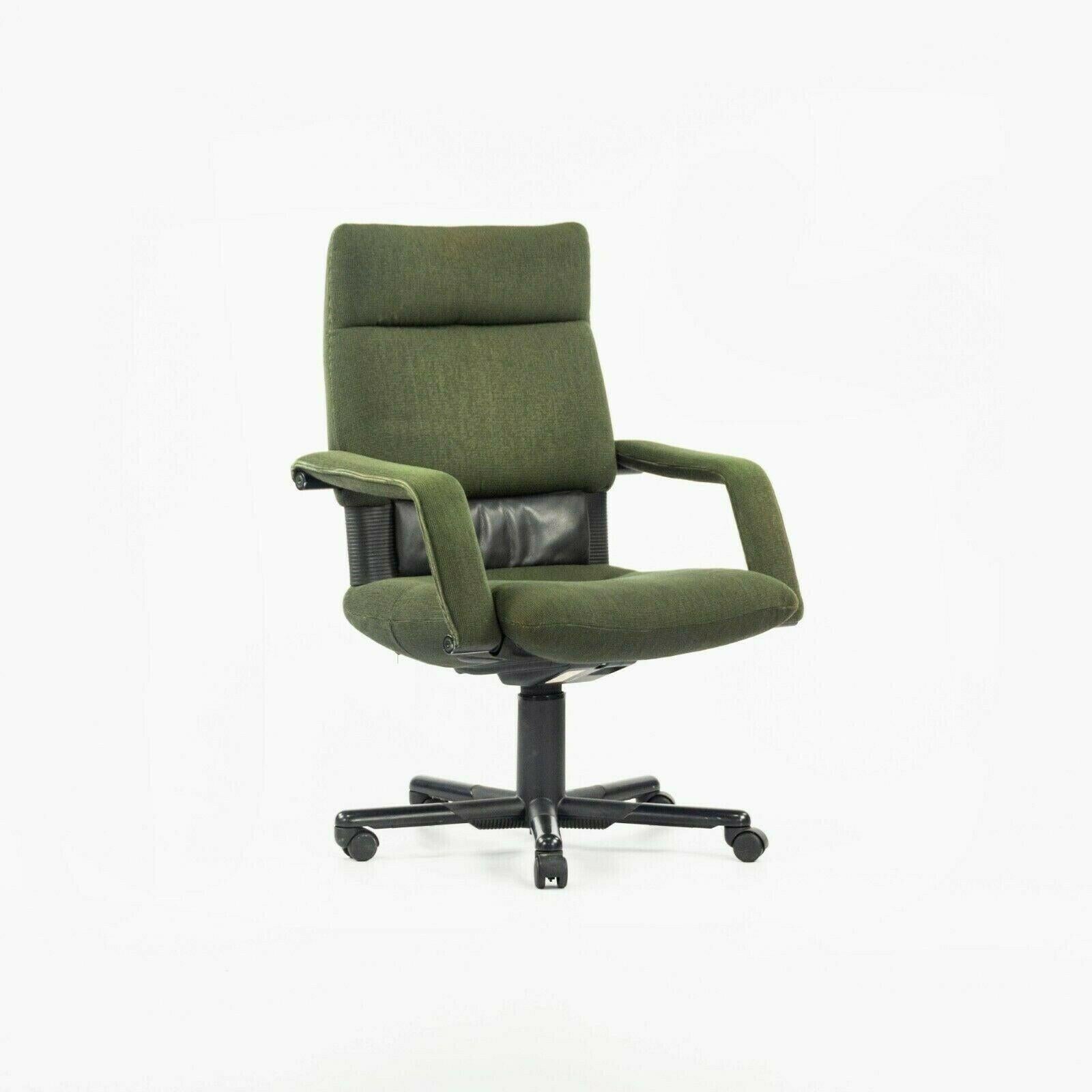Listed for sale is a single (two are available, but the price is for each chair) vintage 1997 Figura desk chair by Vitra, designed by Mario Bellini. These are gorgeous original examples, which retain their original green fabric upholstery.

They are