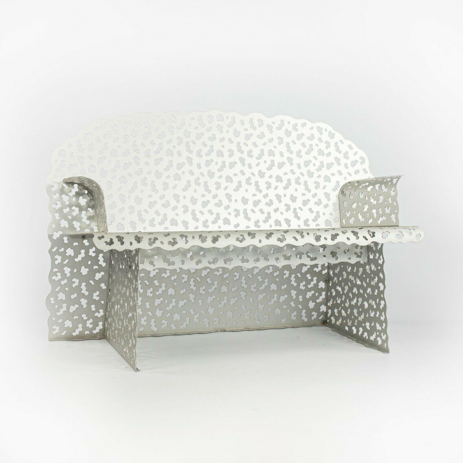 Listed for sale is an exceptionally rare and unusual outdoor Richard Schultz topiary bench. What is particularly unique about this bench is that it has a natural aluminum finish, not a painted finish. This was custom-ordered from Schultz. This