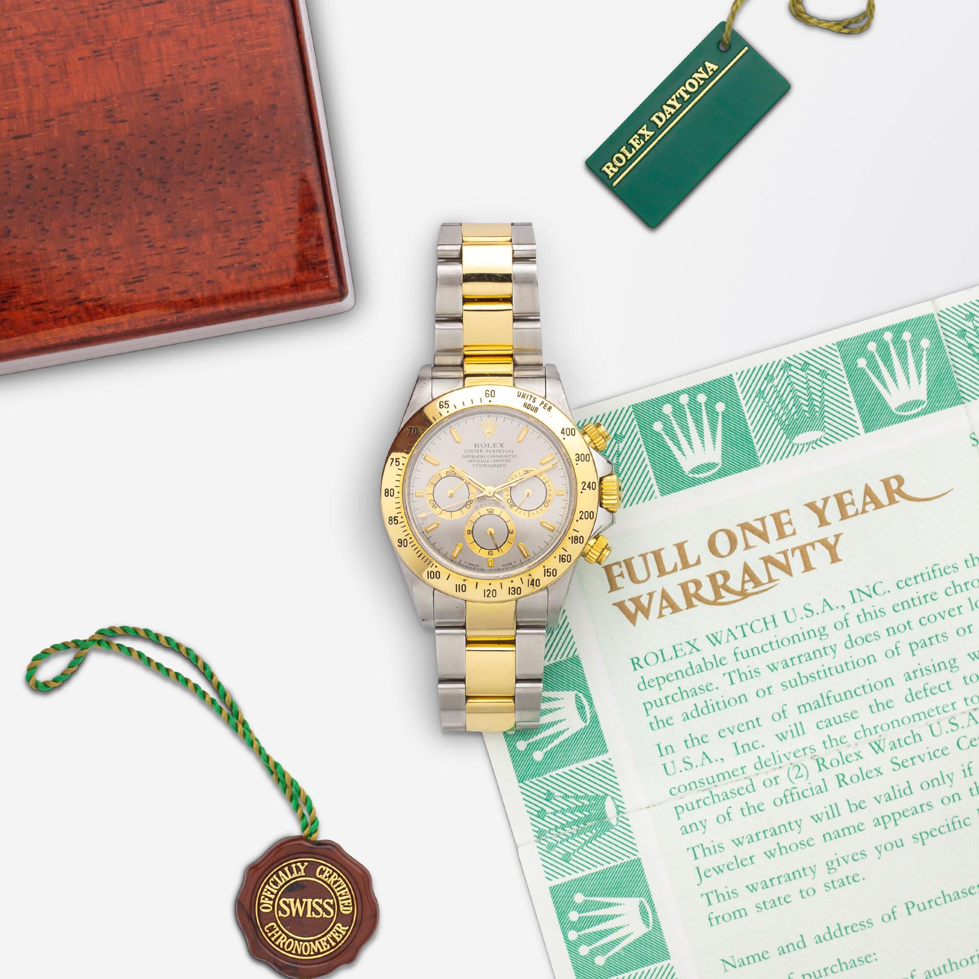 Rolex 'Oyster Perpetual Daytona' wrist watch in stainless steel and 18 karat yellow gold. The case of the watch is crafted from 18 karat yellow gold and stainless steel with a fixed 18 karat yellow gold units per hour bezel. The dial of the watch is