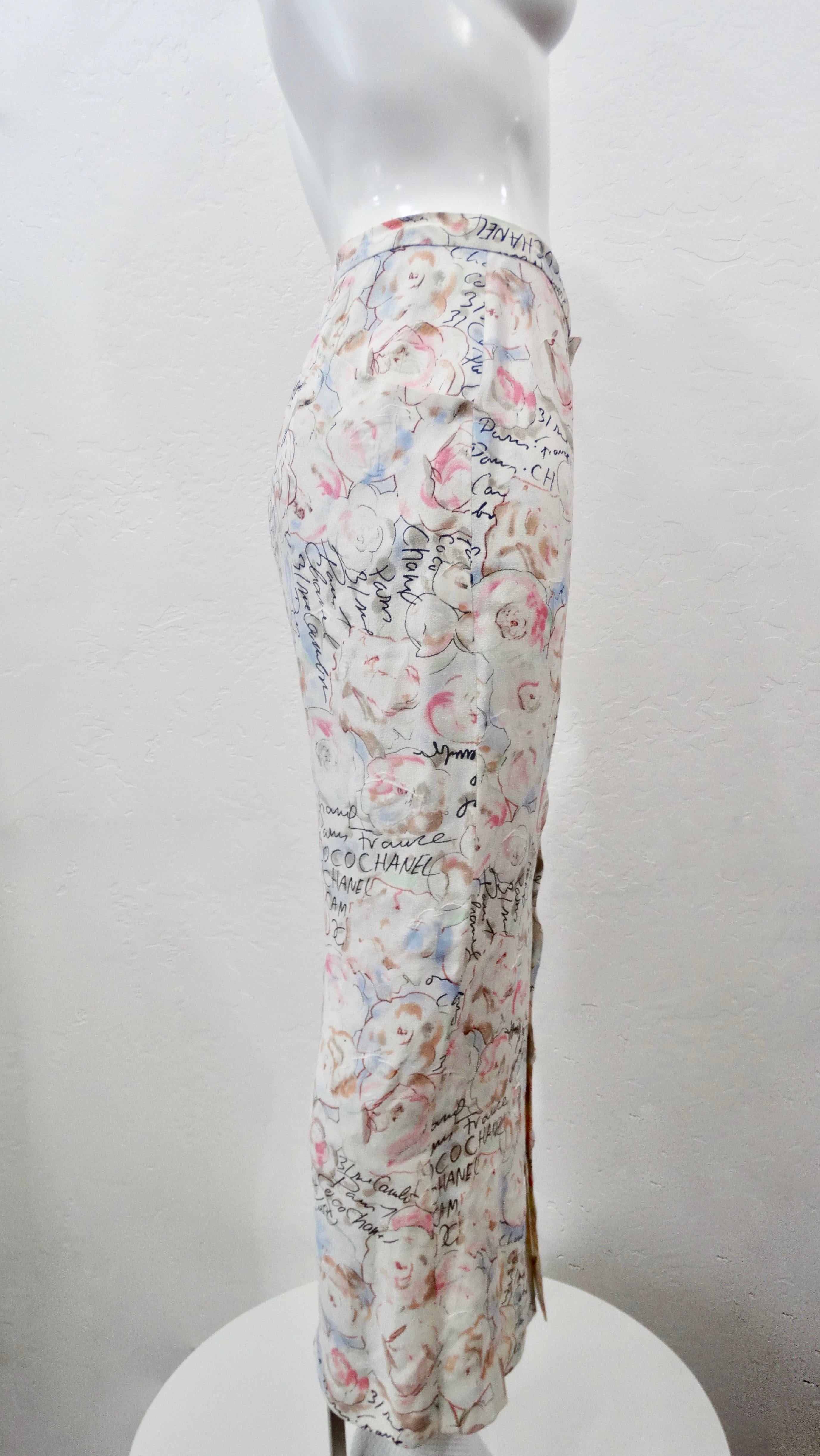Be the ultimate Chanel girl with this adorable skirt! Circa 1998 from their Cruise collection, this maxi skirt features a novelty pastel Camellia flower all over pattern with cursive handwriting that reads 