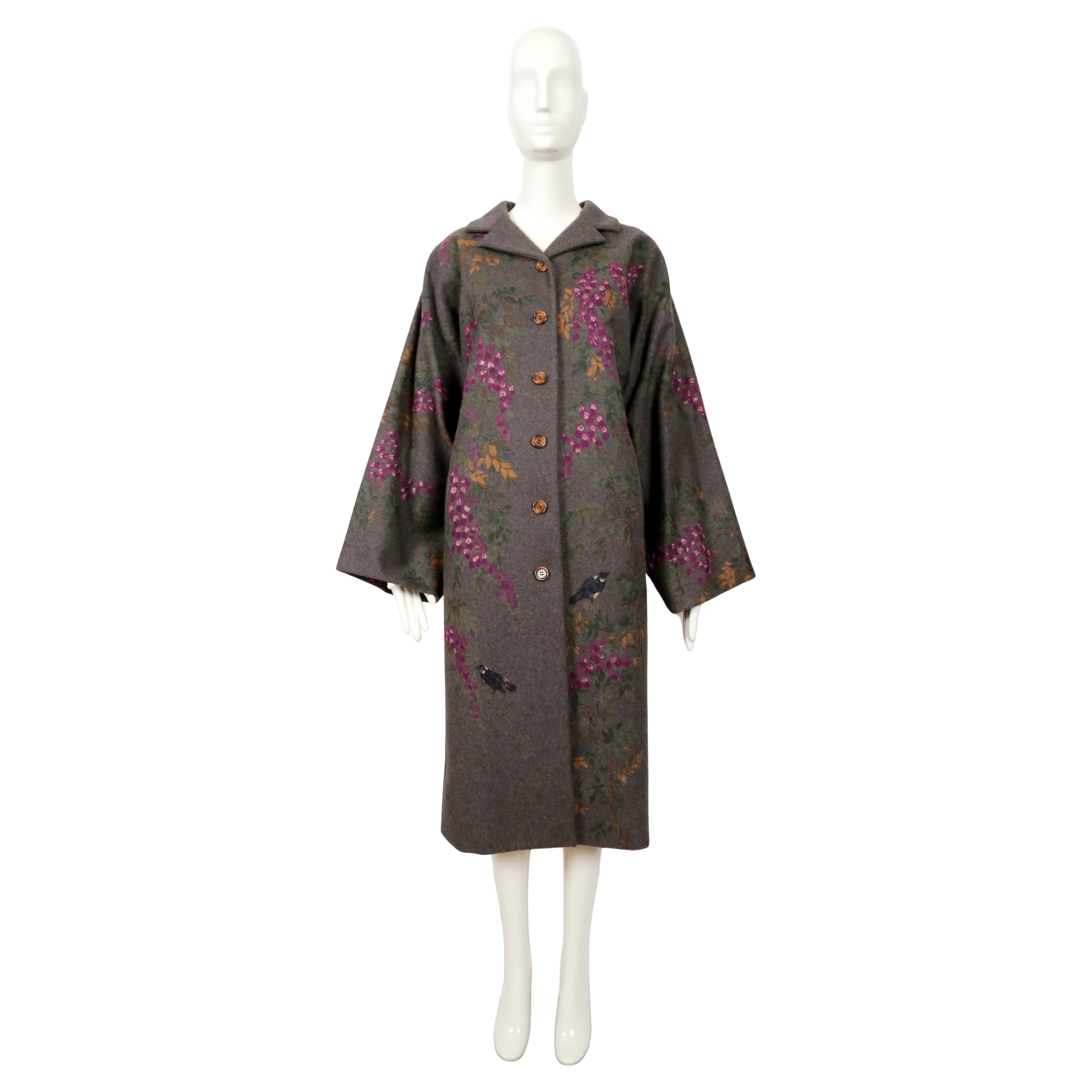 Stunning, hand-painted, heather-grey wool coat with flower and bird motif designed by Dolce & Gabbana dating to fall of 1998. Coat has a 1920's opera coat shape with a notched collar and full 'kimono' style sleeves. Fits slim through the hips. Fully