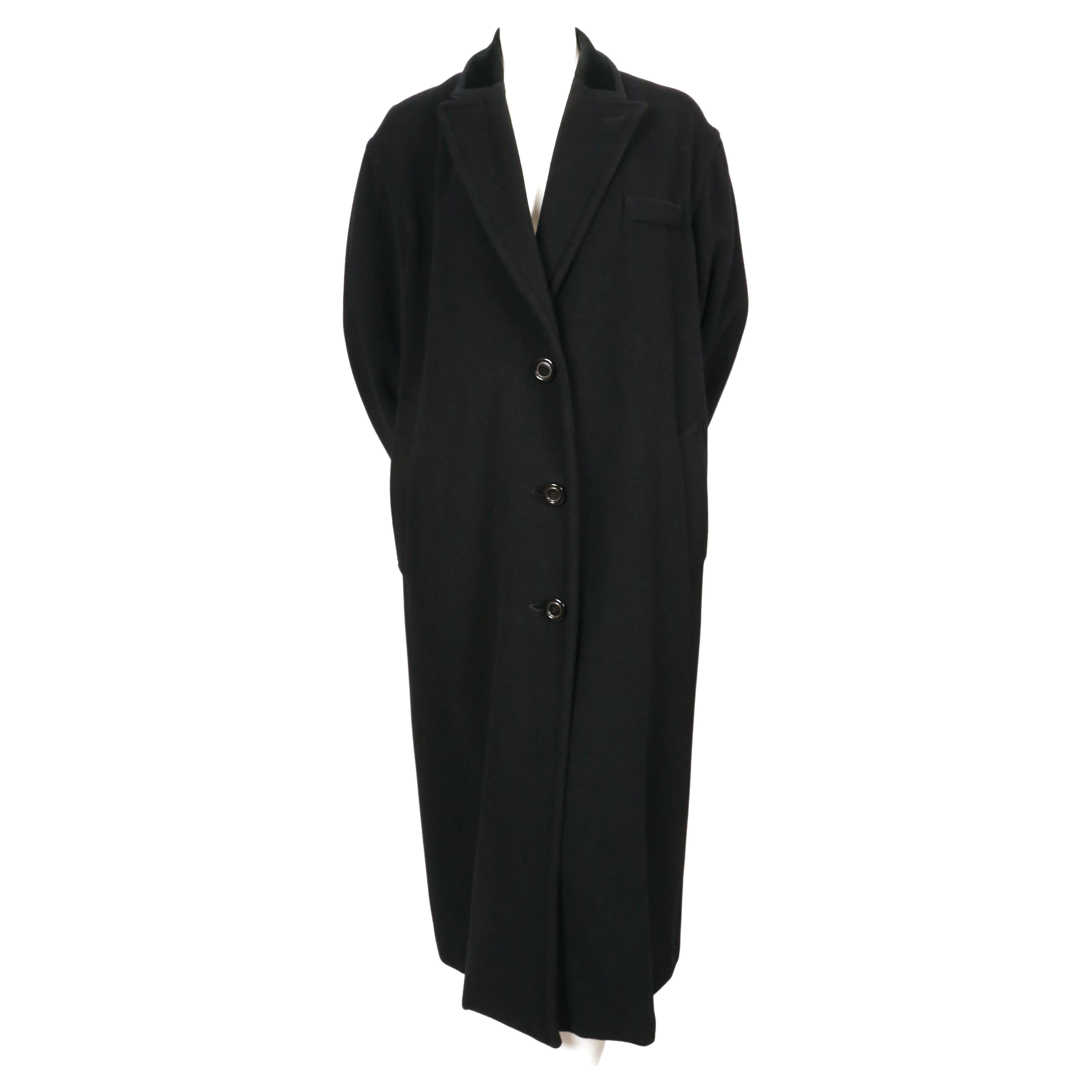 Oversized, black mohair and wool coat with velvet trim designed by Jean Paul Gaultier dating to fall of 1998. Labeled a French 36 however it has a very oversized fit so it will fit a 2-8 depending on desired fit. Coat was not clipped on the size 2