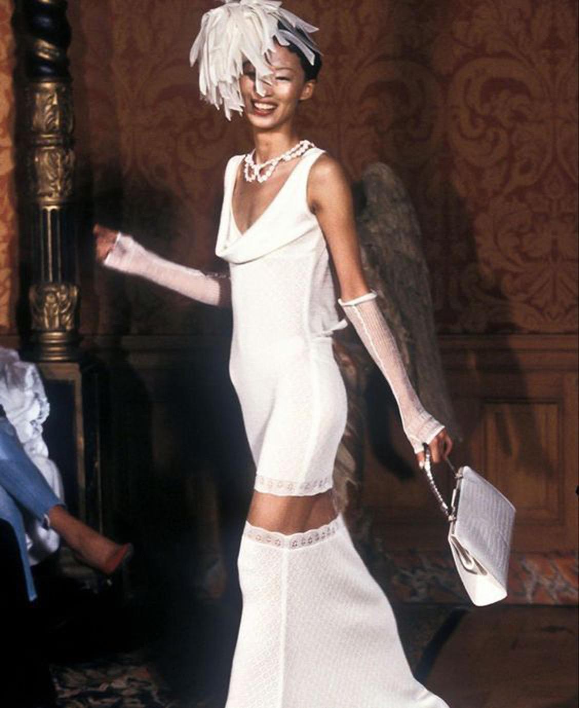 A totally breathtaking and highly coveted John Galliano ivory stretch knit bias cut slip gown dating back to his epic spring/summer 1998 collection. These early documented runway examples of his work are very collectable and are becoming incredibly