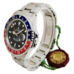 1998 Men's Rolex 40mm GMT Master with Black Dial and Pepsi Bezel. (Unworn)