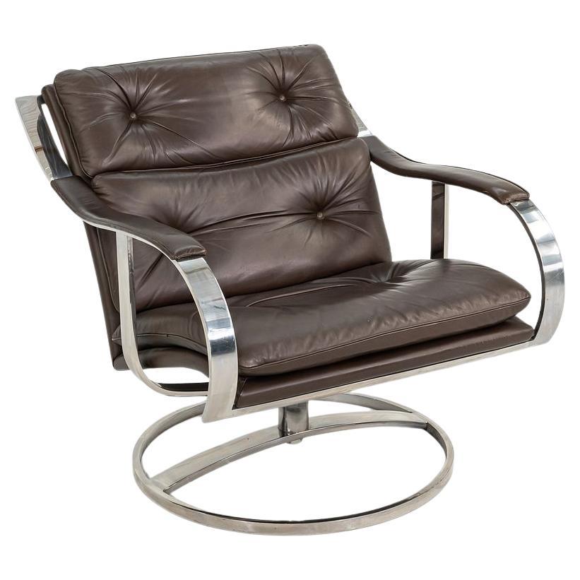This is a handsome pair of Series 455 Swivel Lounge Chairs, initially designed by Gardner Leaver and John Portman for Steelcase in 1971. This pair dates to 1998, and the listed price includes the pair. They feature heavy nickel-plated steel frames,