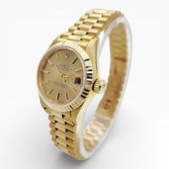 1999 26mm Rolex Presidential 18K Gold with Champagne Dial and Fluted Bezel.