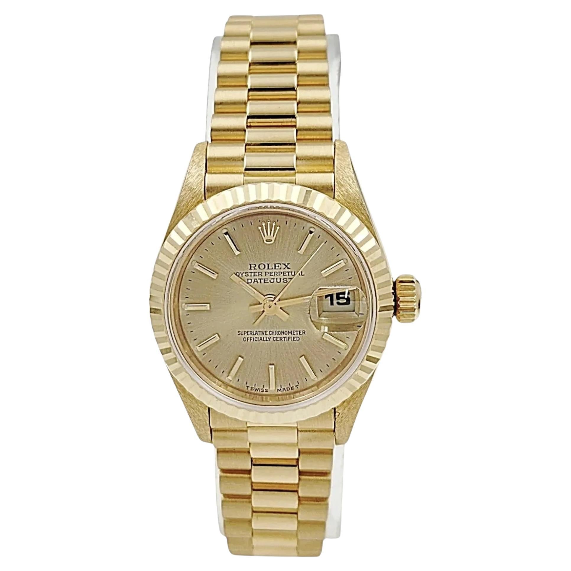 1999 Rolex Presidential de 26 mm de oro de 18 quilates con esfera de champán y bisel estriado.