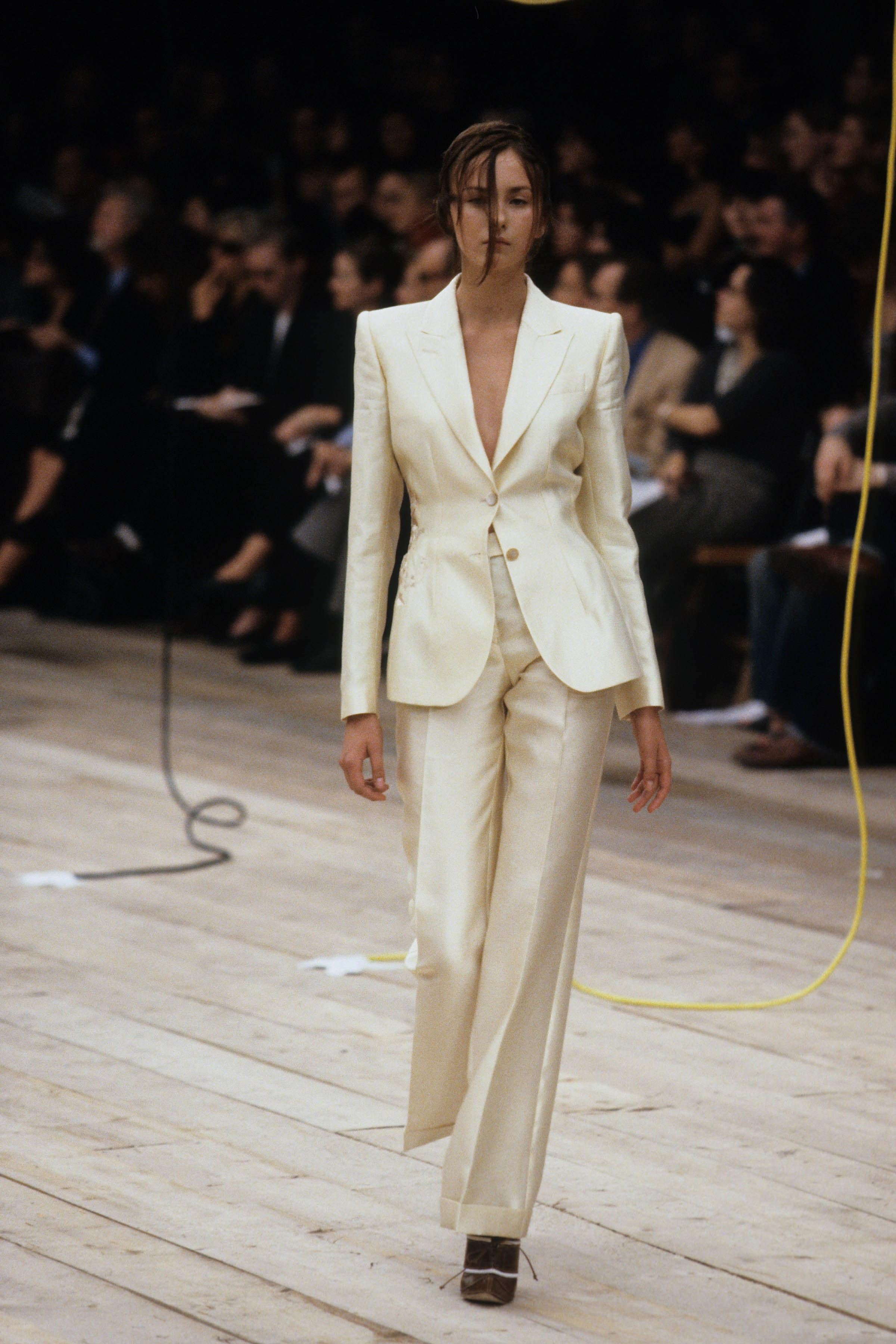 Gorgeous Alexander McQueen runway look 52/76 creme silk jacket from his documented 1999 spring-summer collection. This highly stylized piece is a perfect example of why the magical of Alexander McQueen is so missed. Made of the highest quality silk