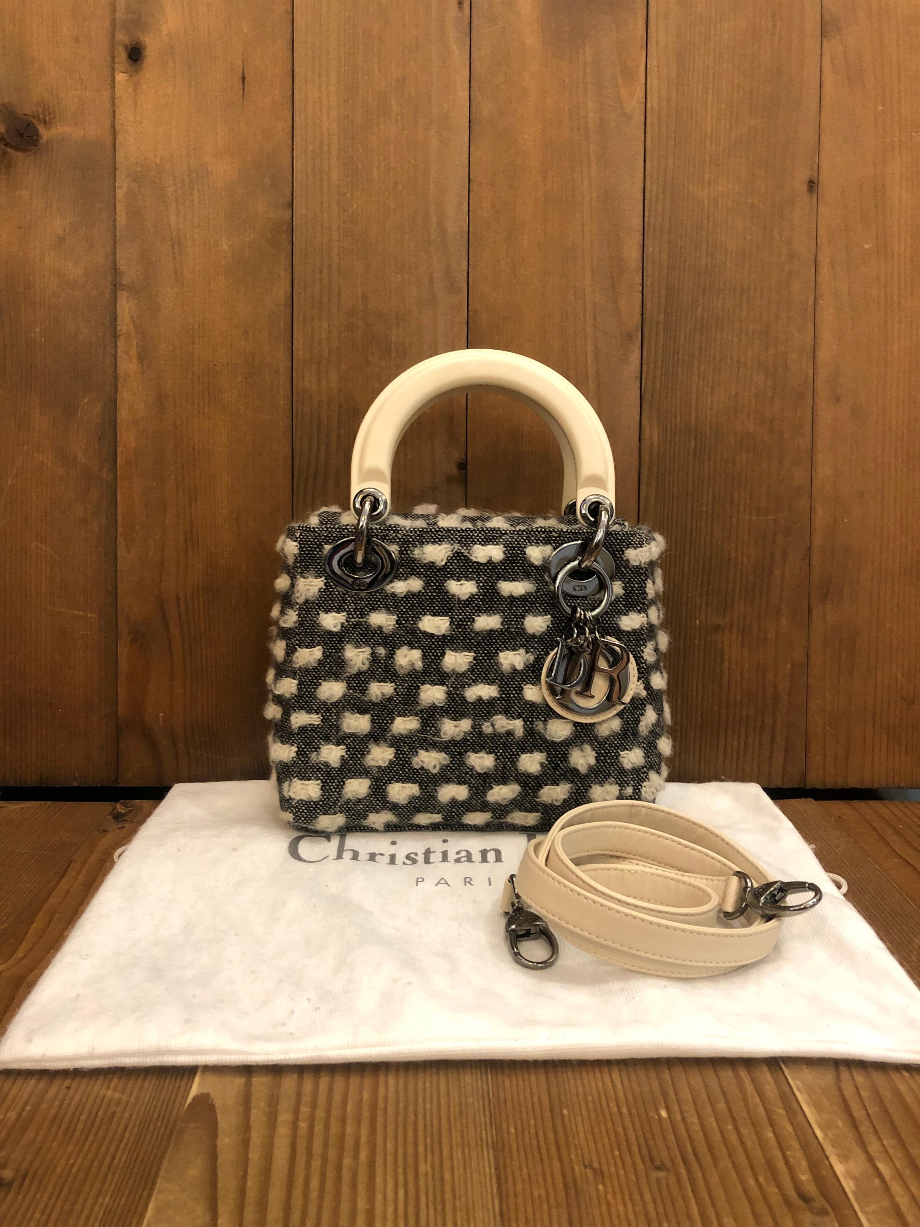 The most iconic Christian Dior handbag, the Lady Dior, in honor of Diana, Princess of Wales. It was the handbag Dior wished to give the Princess of Wales to carry on the occasion of her visit to Paris.

This mini Lady Dior is crafted of black and