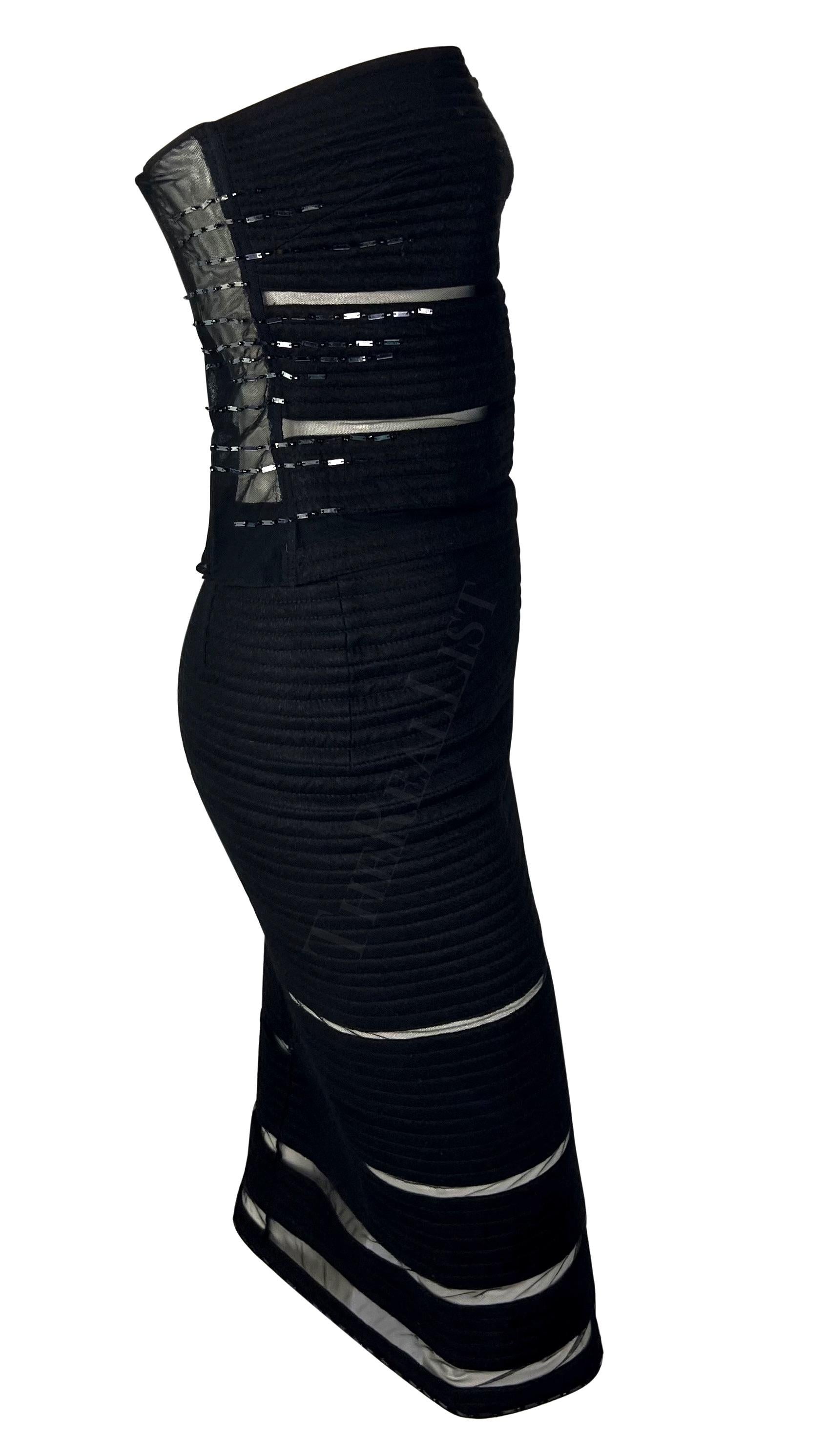 Presenting a fabulous black quilted Gianni Versace skirt set, designed by Donatella Versace. From 1999, this set consists of a pencil skirt and a matching sleeveless top. Both the top and skirt feature a horizontal quilted design with rows of sheer