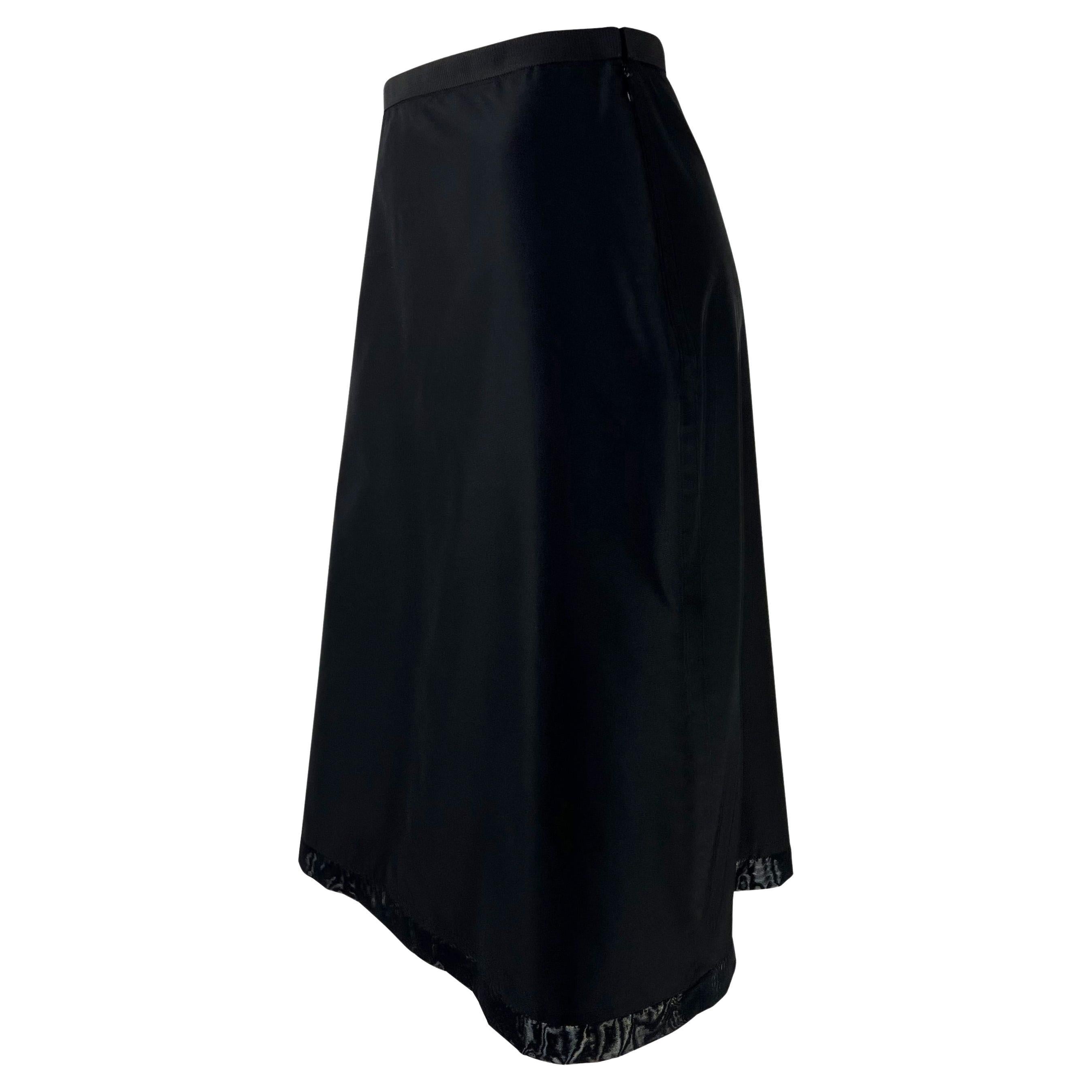 Presenting an black nylon Gucci skirt, designed by Tom Ford. This fabulously chic skirt, from 1999, features an a-line cut and is made complete with a black mesh trim detail at the hem. This skirt is the perfect unique addition to any Gucci by Tom