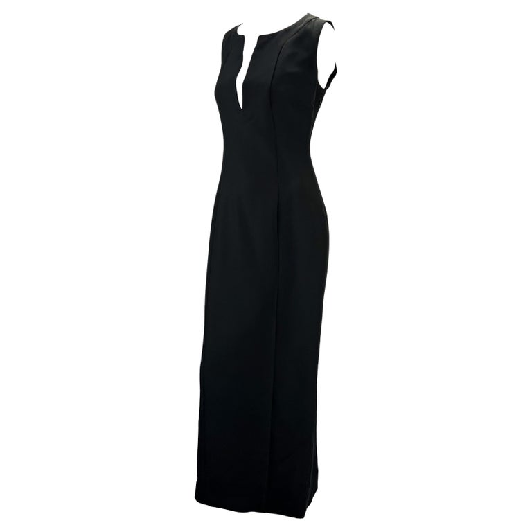 TheRealList presents: a black silk-blend Gucci column dress, designed by Tom Ford. From 1999, this beautiful sleeveless dress features a plunging neckline, slit at the back, and fitted waist. Effortlessly chic, this floor-length dress is sure to