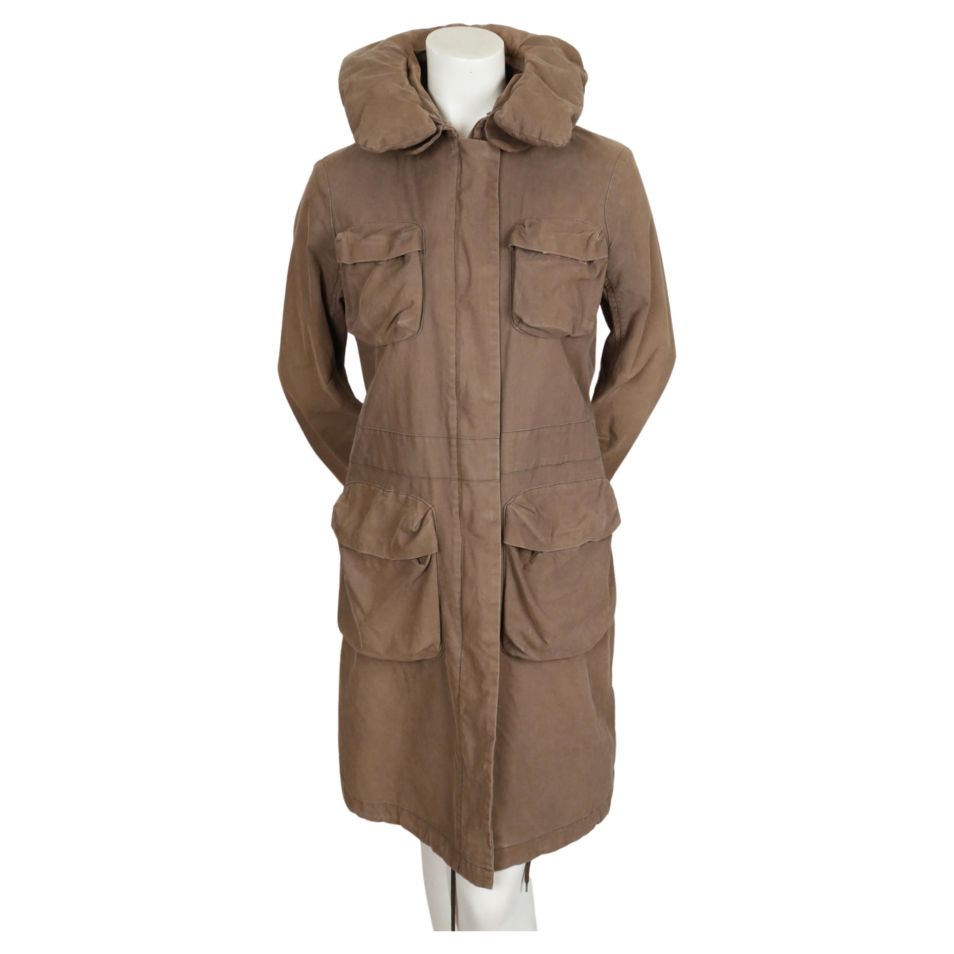 Khaki brown/green cotton parka coat with padded collar and bondage straps designed by Helmut Lang as seen on the fall 1999 runway. Italian size 40. Approximate measurements: shoulder 16.5