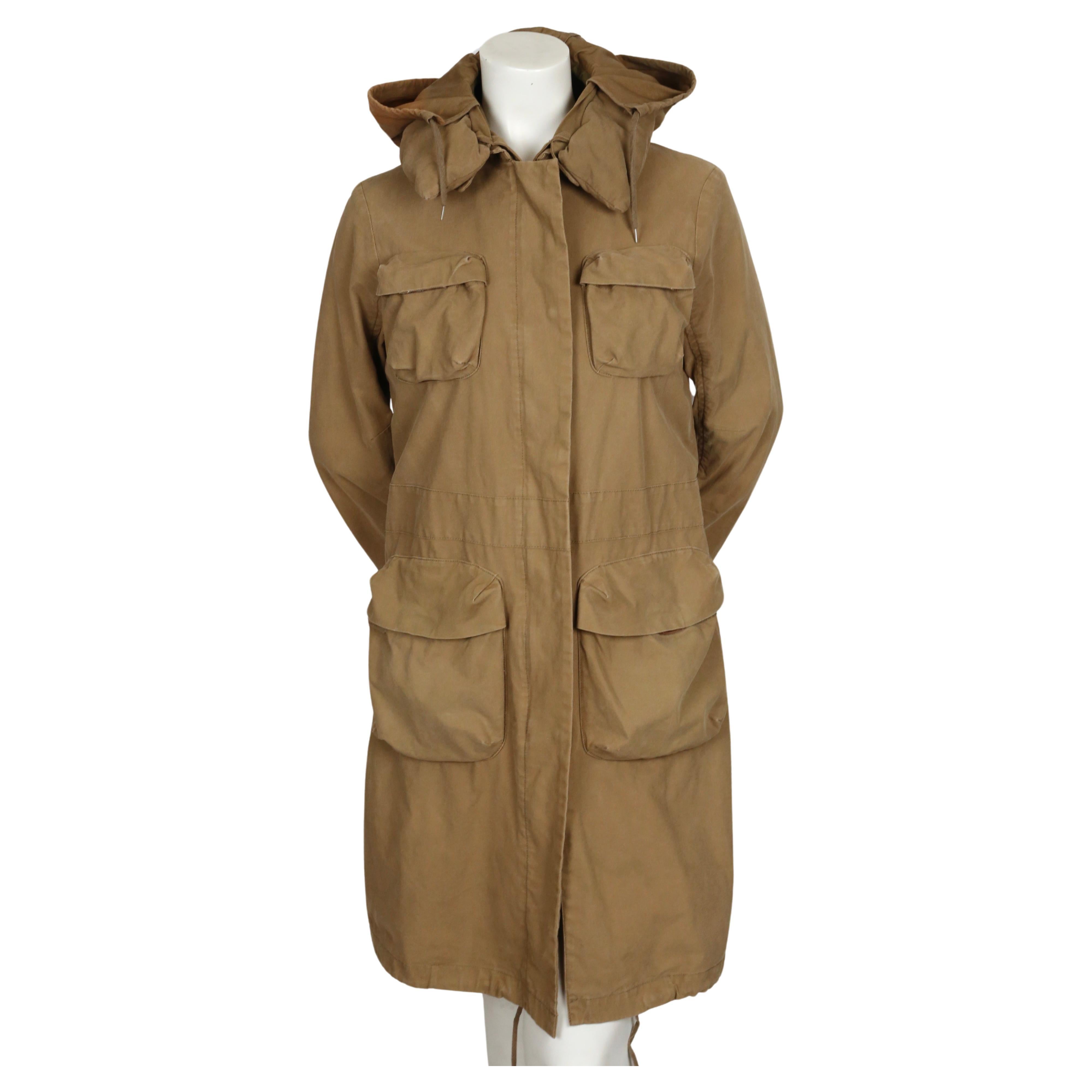 Khaki brown cotton parka coat with padded collar and bondage straps designed by Helmut Lang as seen on the fall 1999 runway. Italian size 40. Approximate measurements: shoulder 16.33
