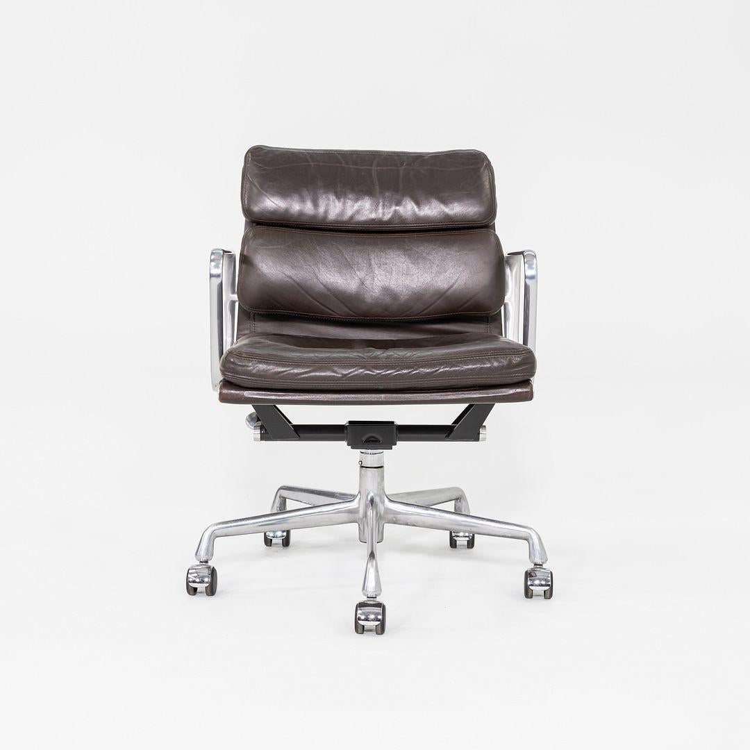 This is an Eames Aluminum Group Soft Pad Management Desk Chair, Model EA435, originally designed by Charles and Ray Eames for Herman Miller in 1969. These examples date to the year 1999. The design features a cast aluminum frame with adjustable