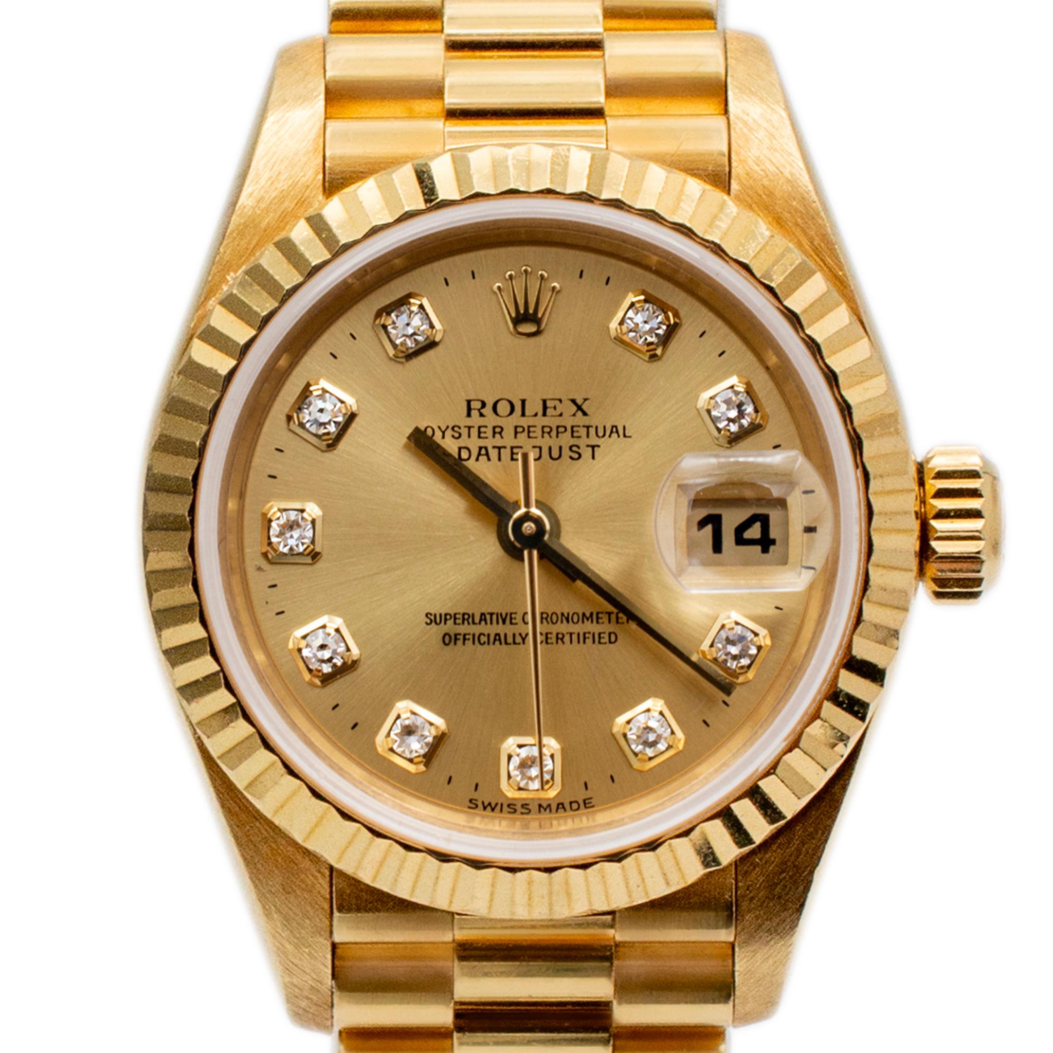 Brand: Rolex

Gender: Ladies

Metal Type: 18K Yellow Gold

Diameter: 26.00 mm

Weight:  73.74 grams

Ladies 18K yellow gold, diamond ROLEX Swiss-made watch with original box and papers. The metal was tested and determined to be 18K yellow gold. The