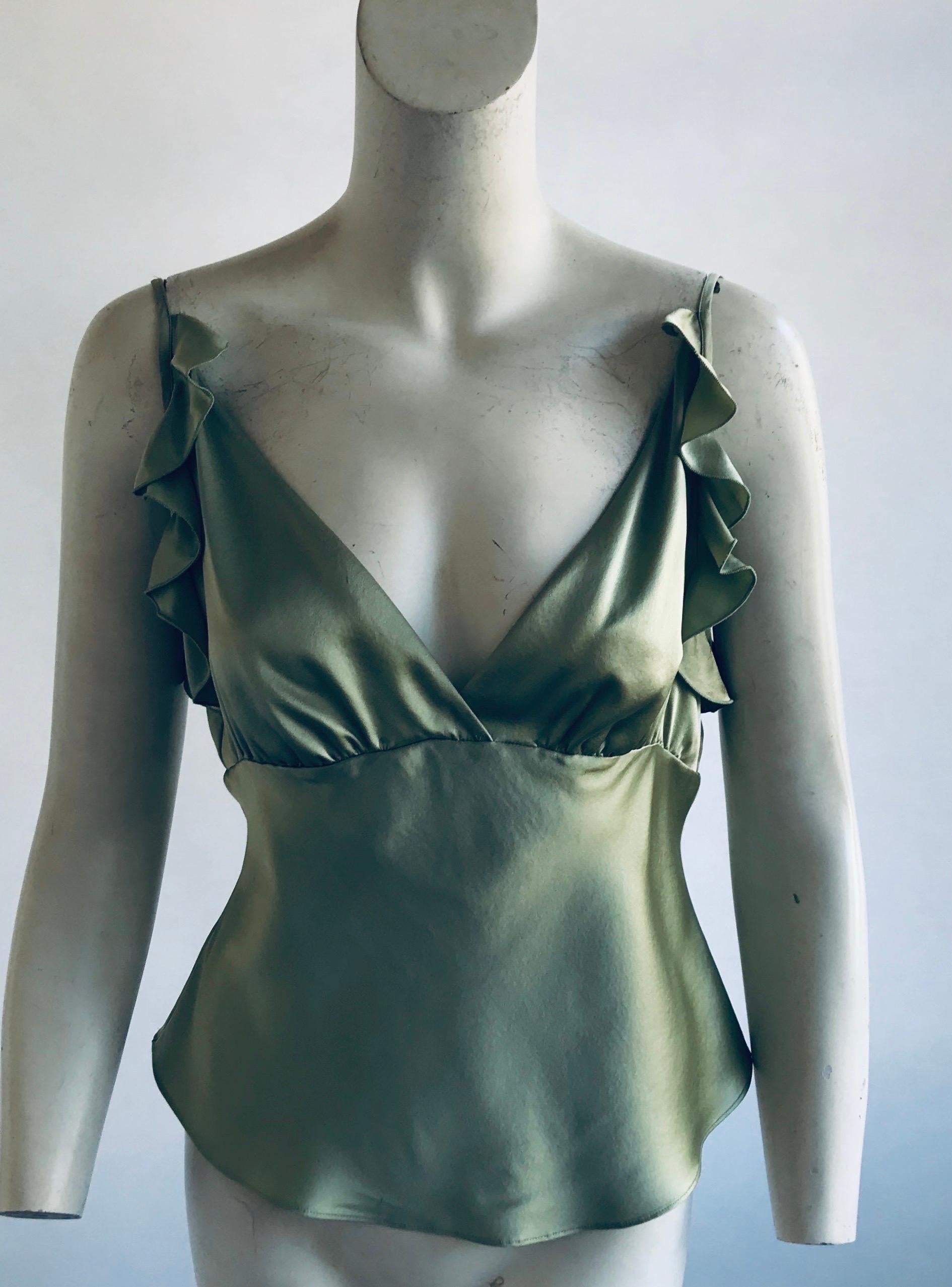 Gorgeous Chloe top from Stella McCartney’s second collection for the label 
Buttons up the back with silk covered buttons 
Flutter cap sleeves 
100% silk 
Size tag has gone missing this measures 34” at the bust 29” at the waist and 22” in length