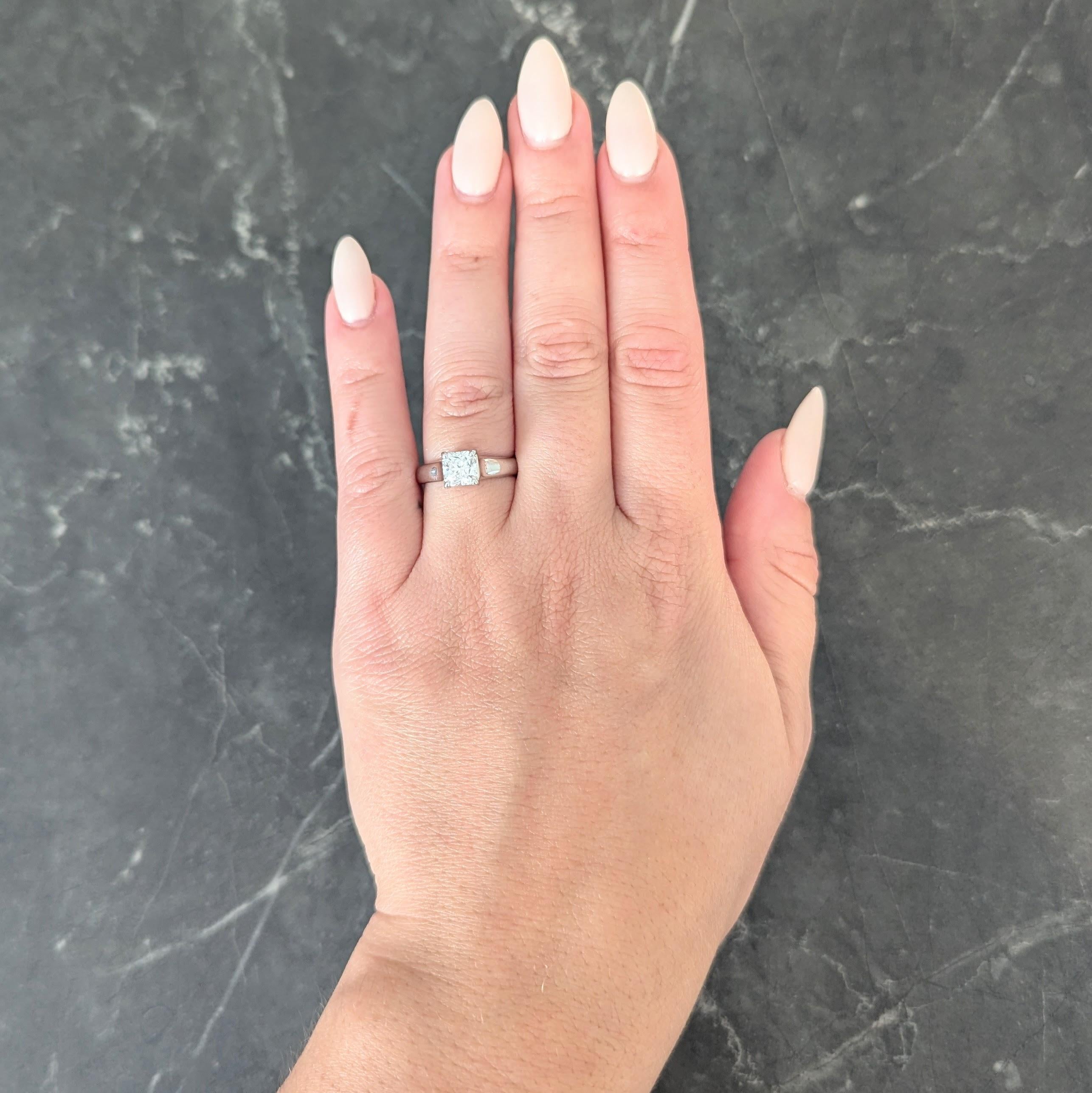 Centering a signature Lucida cut diamond weighing 1.12 carats total - D color with VVS1 clarity
With 'Lucida' inscribed girdle - prong set in an elegant weave motif basket
With high polished platinum finish
Inscribed with carat weight
Stamped for
