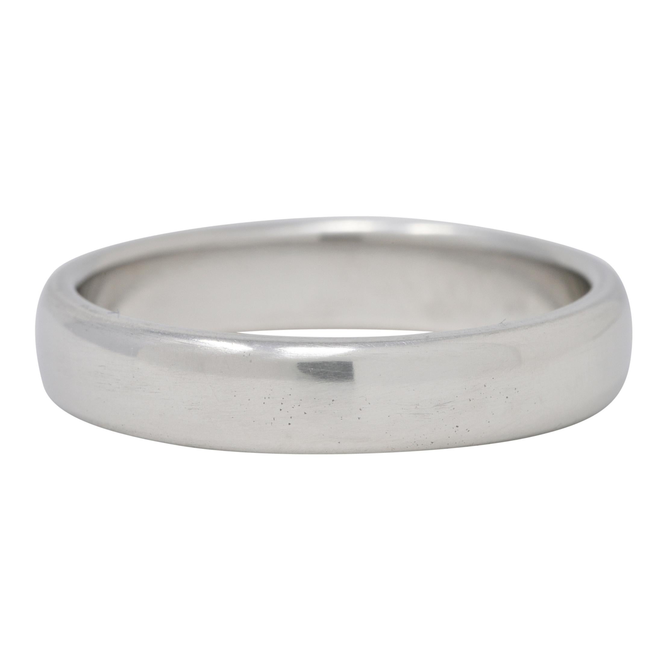 Designed as a comfort fit style band with rounded edges
Completed by a high polish
Stamped PT950 for platinum
Fully signed for Tiffany & Co.
Circa: 1999; via dated inscription
Ring Size: 9 and sizable
Measures 4.5 mm north to south and sits 2.0 mm