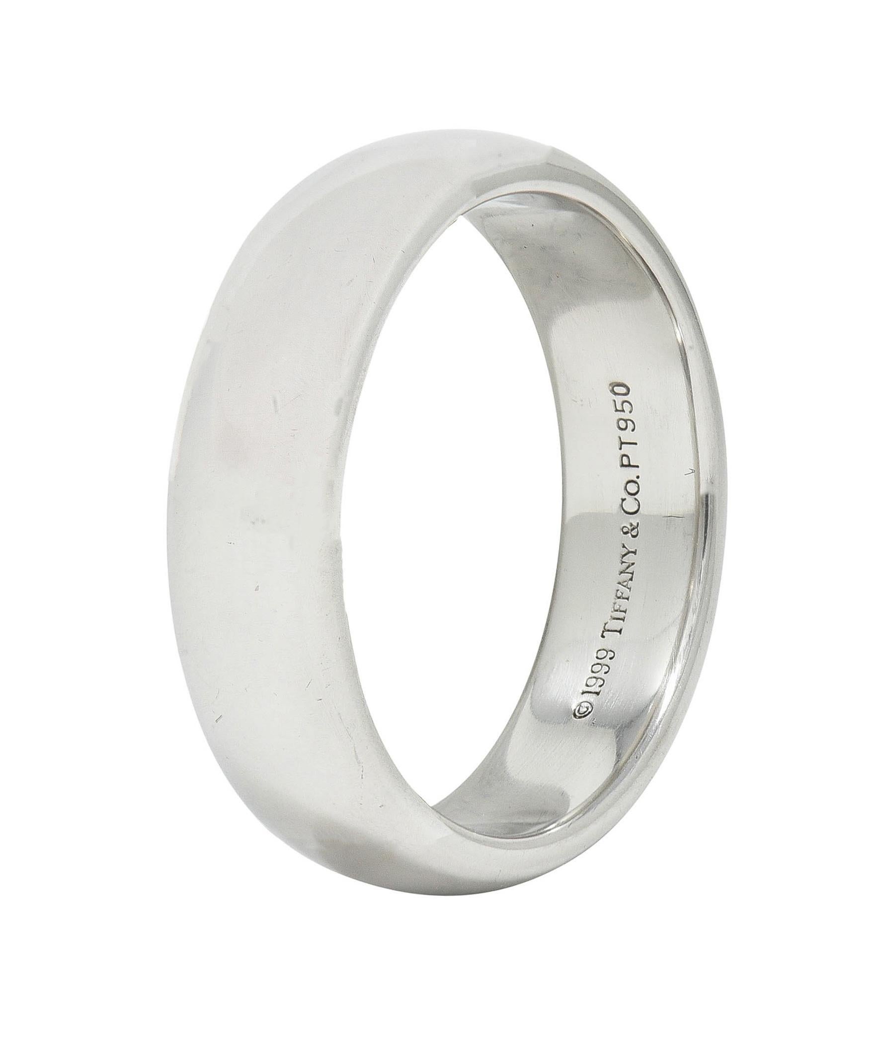 Designed as a comfort fit style band with rounded edges
Completed by a high polish
Stamped PT950 for platinum
Fully signed for Tiffany & Co.
Circa: 1999; via dated inscription
Ring Size: 9 and sizable
Measures 6.0 mm north to south and sits 2.0 mm