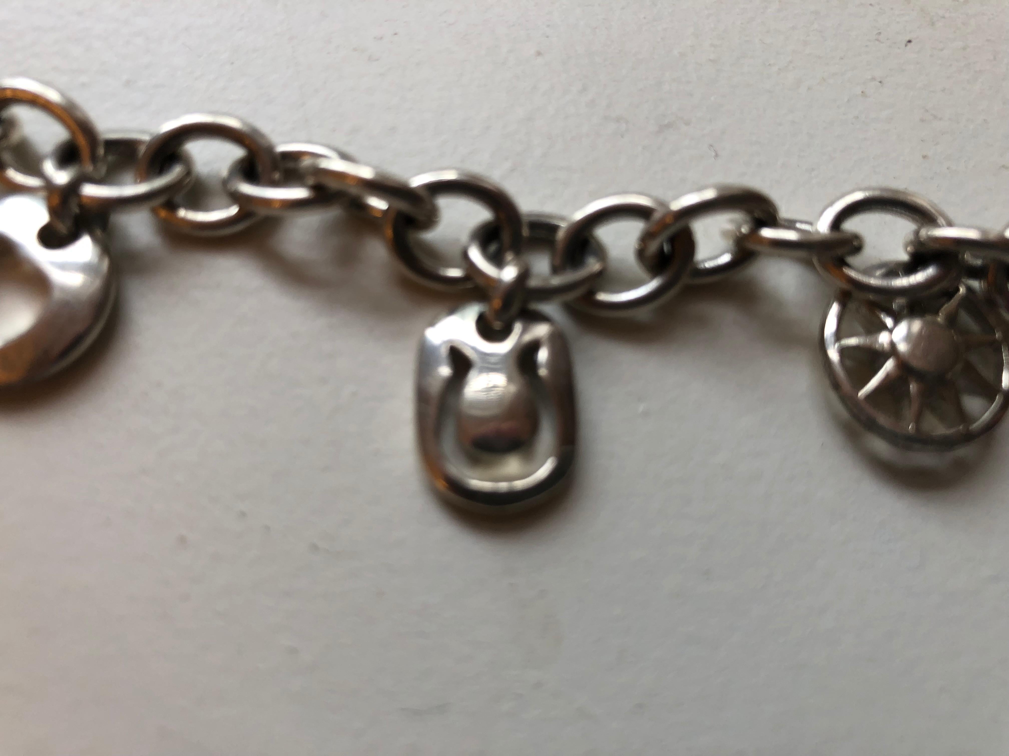 1999 Tiffany & Co Silver Heart Sun Star Moon Horseshoe Charm Bracelet In Excellent Condition In Port Hope, ON