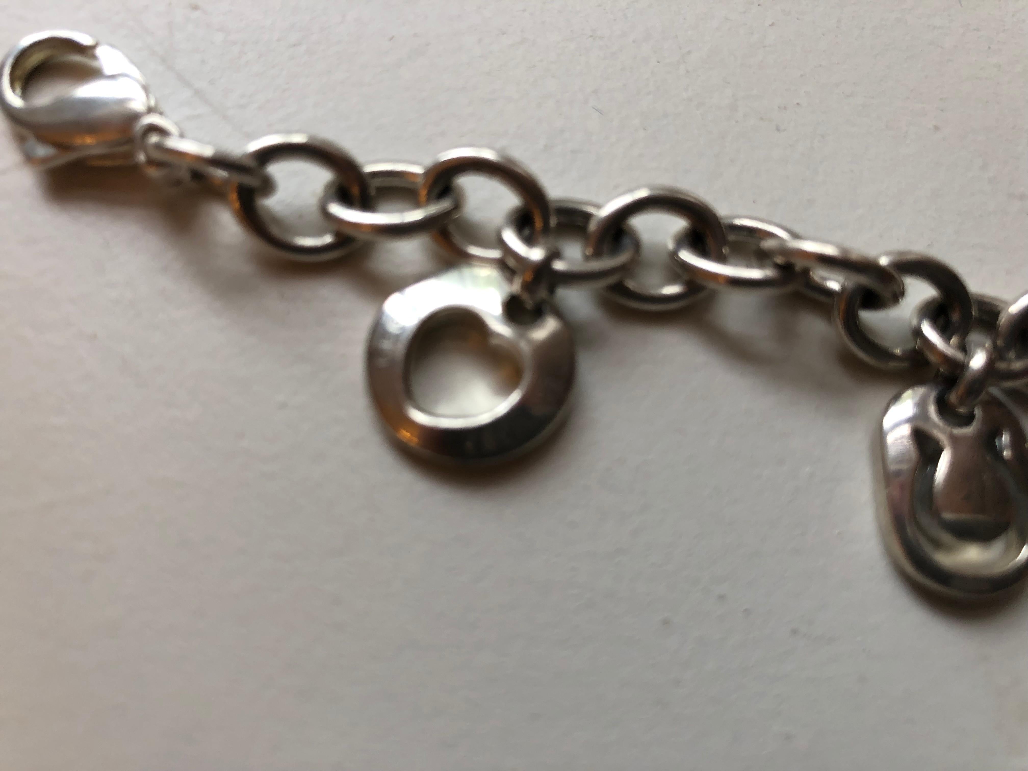 1999 Tiffany & Co Silver Heart Sun Star Moon Horseshoe Charm Bracelet 1