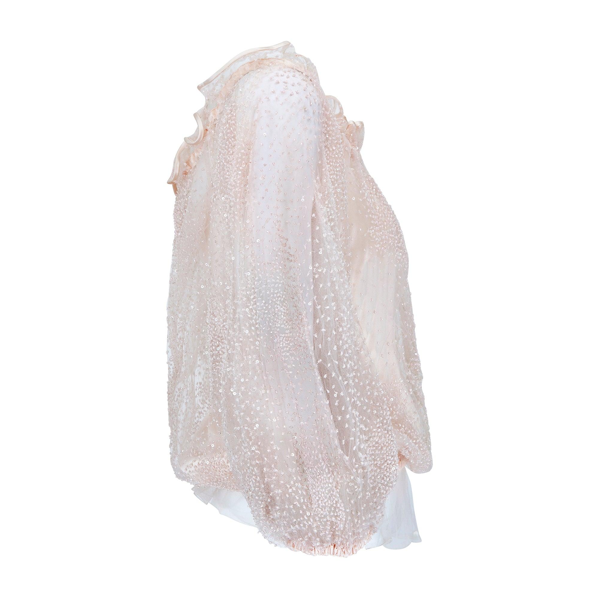 This enchantingly whimsical blouse walked the runway for Valentino’s Spring 1999 show. Designed when Valentino Garavani himself was still at the helm of the house, this blouse epitomises the romantic, seductive designs that made his label a