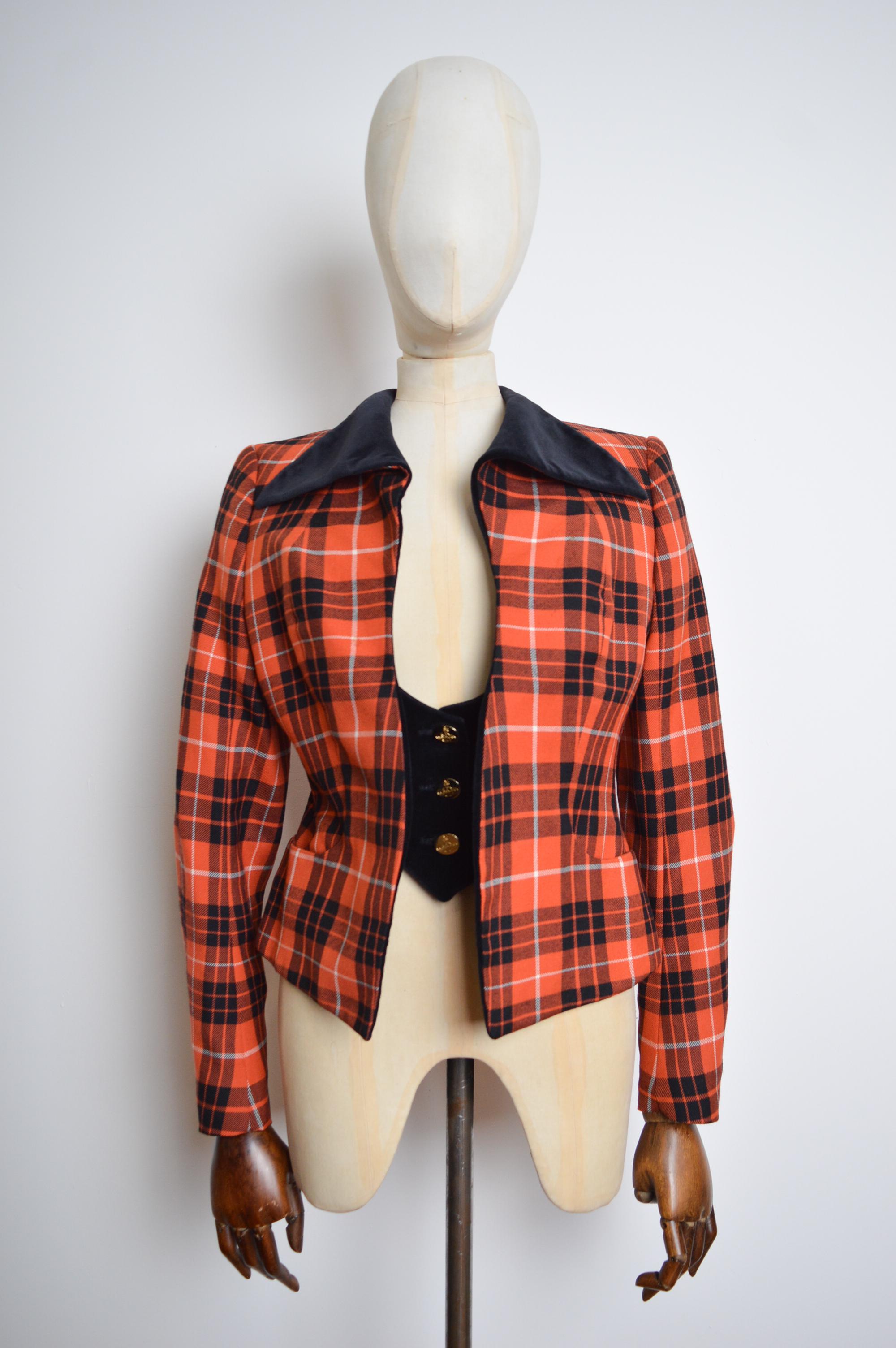 Superb Vintage Vivienne Westwood Runway 'Gold Label' Couture Suit.
Reference 'The Glasgow Show' 1999, Scottish Exhibition Conference Center. 

100% WOOL (Made in SCOTLAND)

The Suit comprises a beautifully Tailored Jacket with a built in figure