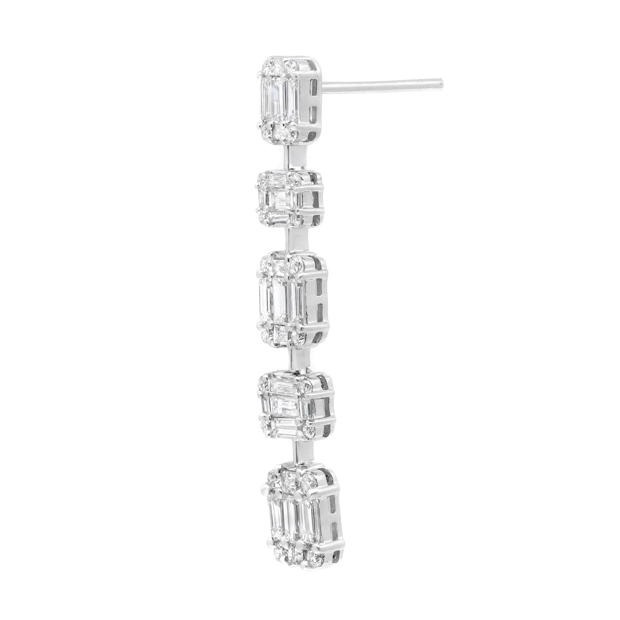 Showcasing these enchanting eye catchy drop earrings, crafted in 18k white gold. These earrings feature channel set Baguette cut and round cut sparkling diamonds weighing 1.93 carats. Diamond quality: color G-H and clarity VS-SI. Earring length: 1.3