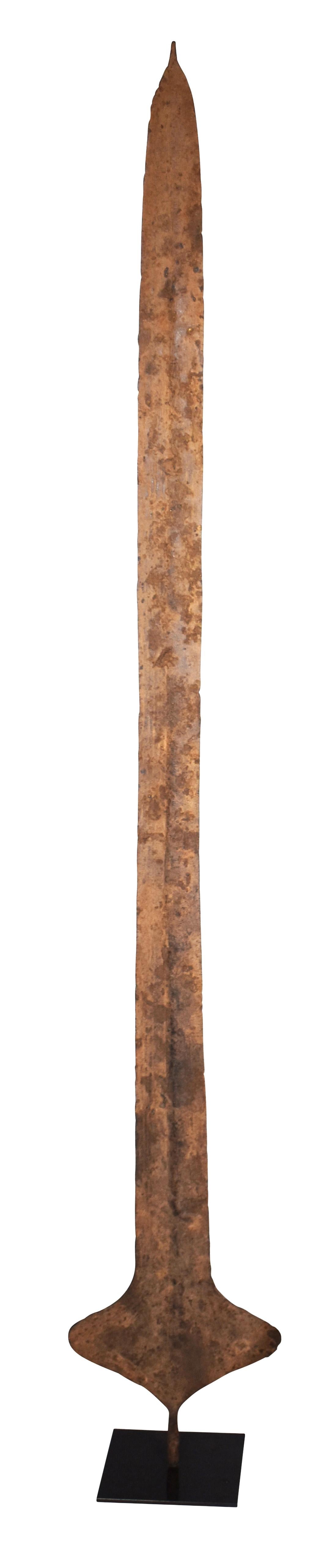 African currency Sword used in Congo for important transactions such as dowry or land purchase. Patina and sculptural shape give the feel of contemporary art mixed with 19th century history. Displayed on metal stand.