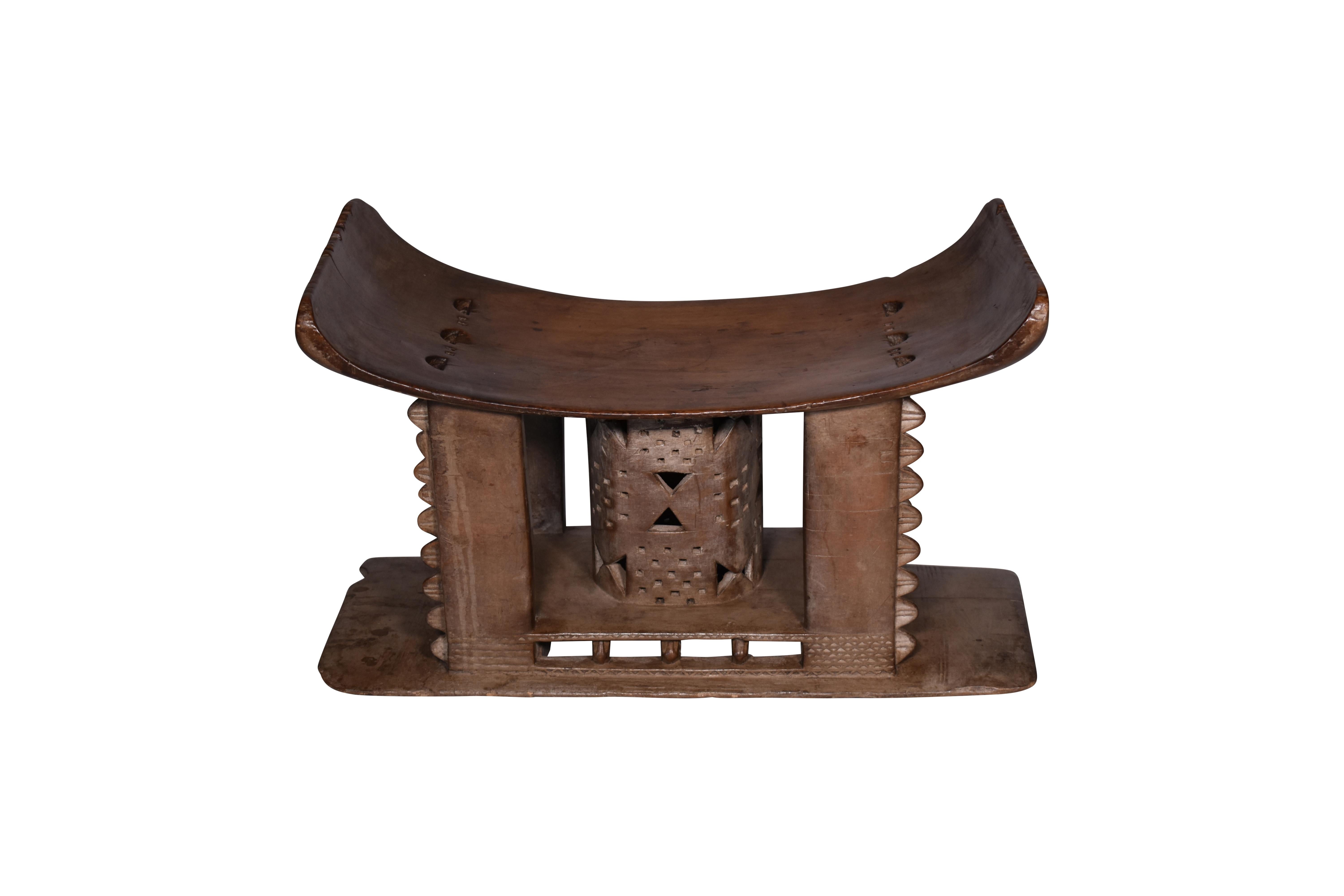 Intricately hand-carved 19th century African Pale Brown wooden tribal stool. Tribal stools were carved from a solid piece of wood.
