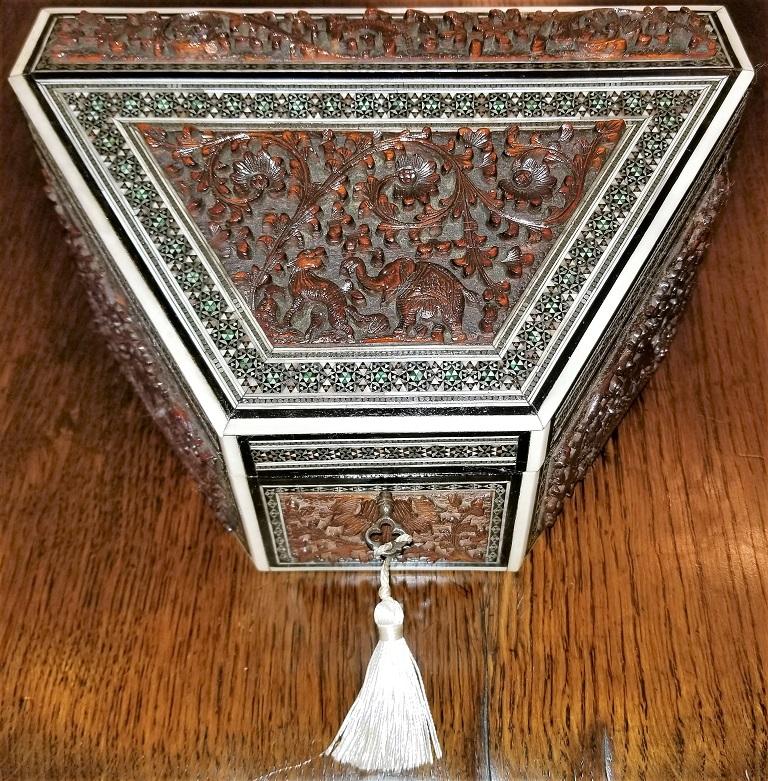 Lovely Anglo-Indian carved Padouk wood, faux ivory and sadeli mosaic stationary box.

Made in Bombay, India in the 19th century, circa 1880.

The box is constructed of sandalwood the covered in bone or faux ivory and carved Padouk panels