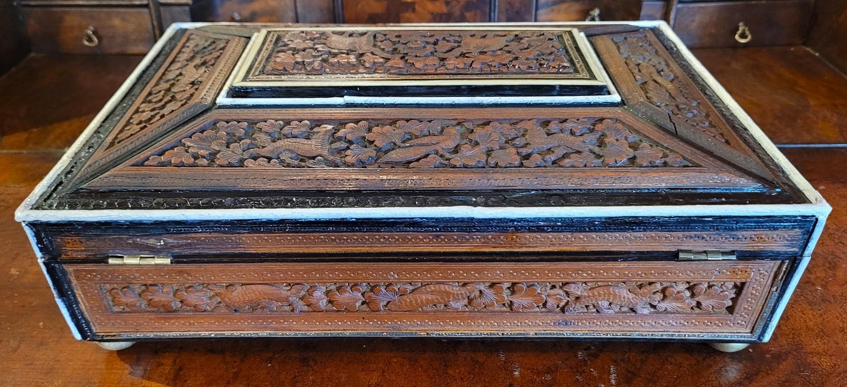 19c Anglo Indian Highly Carved Padouk and Sandalwood Sarcophagus Sewing Box In Fair Condition For Sale In Dallas, TX