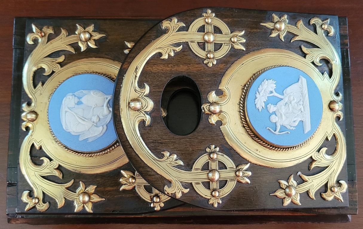 PRESENTING A GORGEOUS, VERY HIGH QUALITY AND RARE 19C British Coromandel, Brass with Large Jasperware Medallions Book Slide.

Probably made in England circa 1870-80, from glorious imported Coromandel wood imported from the British Empire Colony of