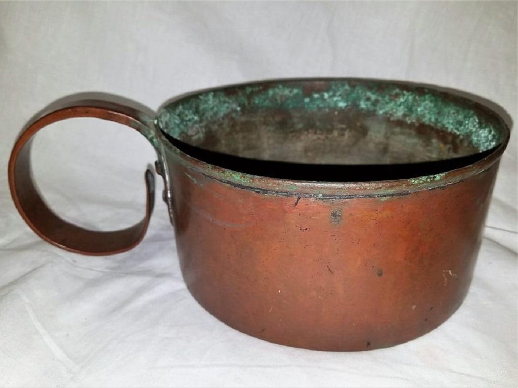 Presenting an extremely rare 19th century copper rum cup or mug or measuring mug.

Large mug. It holds 96 Fl Ounces or 3 Quarts.

From circa 1840-1860, probably from the American Civil War Era and made of solid copper, with large copper handles