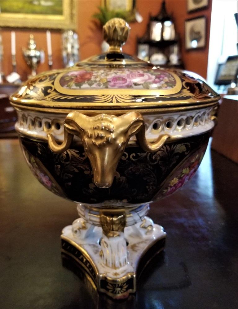 PRESENTING a GLORIOUS Early 19C Derby Porcelain Lidded Centerpiece.

Early piece of Derby porcelain, with early mark. From circa 1800-20.

Entirely hand-painted and hand gilded in 24ct gold.

The Lid has a gilded ‘crocus’ flower finial with 3