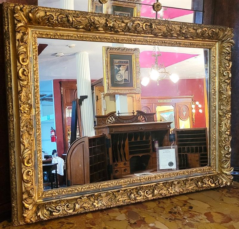PRESENTING A LOVELY 19 century English Baroque Gilt Floral Wall Mirror.

English, circa 1840.

In classic ‘Baroque’ style with scrolling acanthus and vines in very ornate design and detail. Made of giltwood, pine, oak and gesso.

Probably