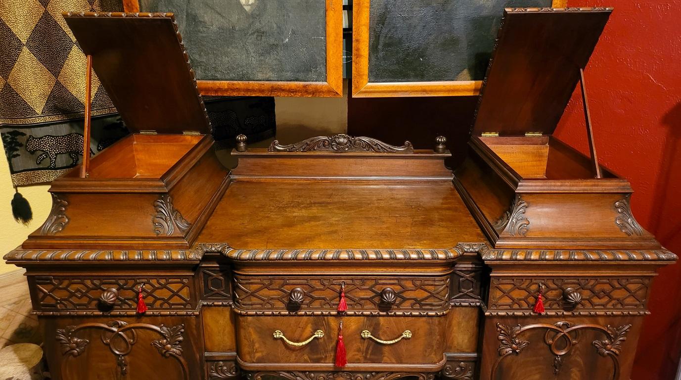 PRESENTING A STUNNING AND VERY HIGH QUALITY 19C English Chinese Chippendale Mahogany Buffet or Sideboard.

Probably English, unmarked, but undoubtedly by one of the top makers, due to it’s quality!

Circa 1850-70.

Made of the best Cuban flamed
