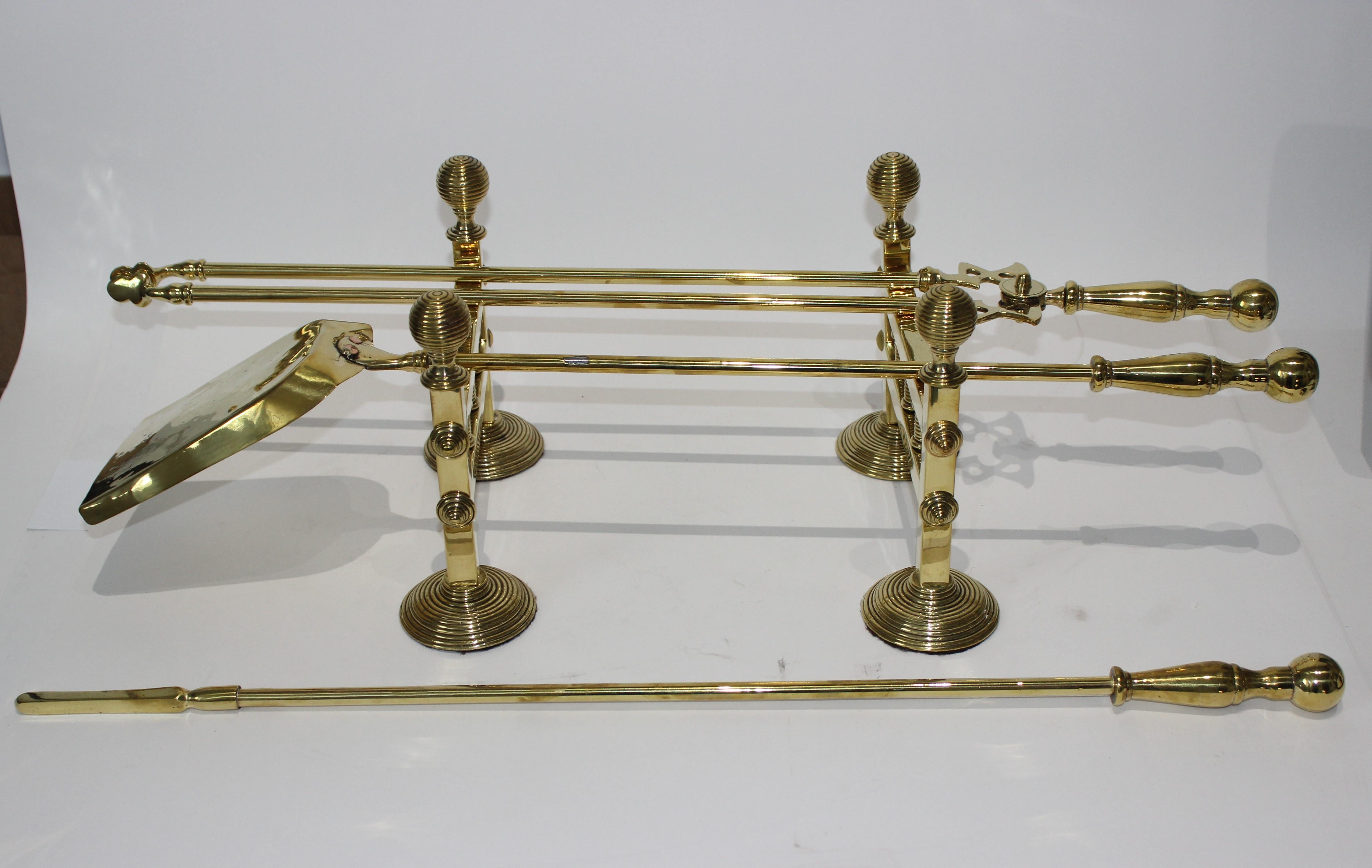 19th century fireplace accessories, trio of fireplace tools on pair of tool stands (racks)

The tools are all approximately 26.5