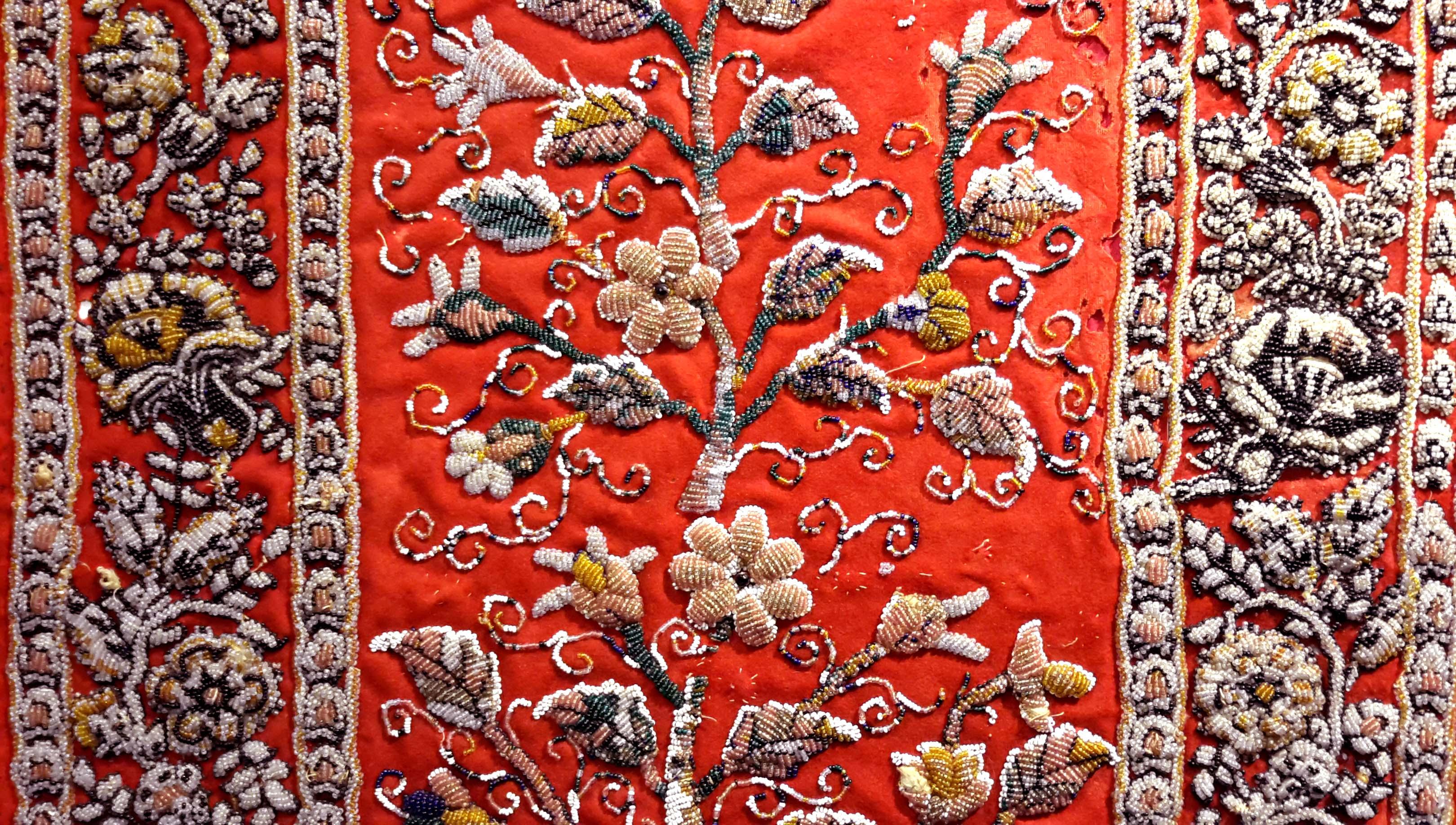 19th century raised beadwork panel textile. Possibly ottoman, Turkish. All handmade on a red wool background. Later framed.